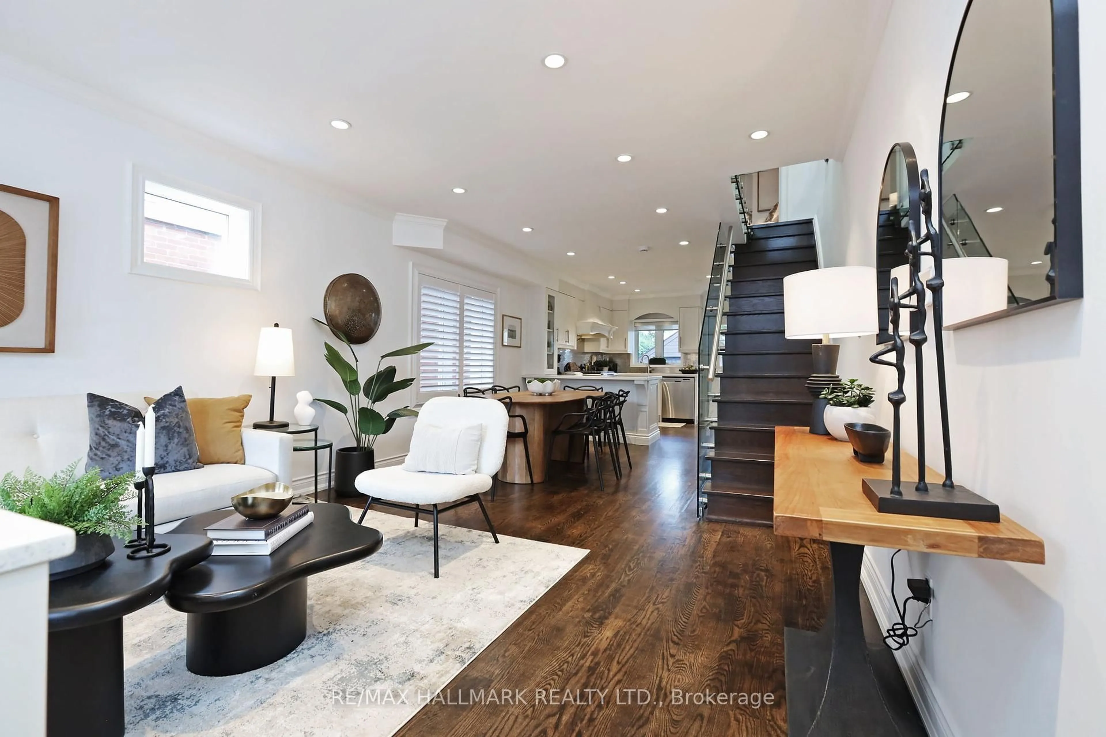 Living room with furniture, wood/laminate floor for 242 Springdale Blvd, Toronto Ontario M4C 1Z9