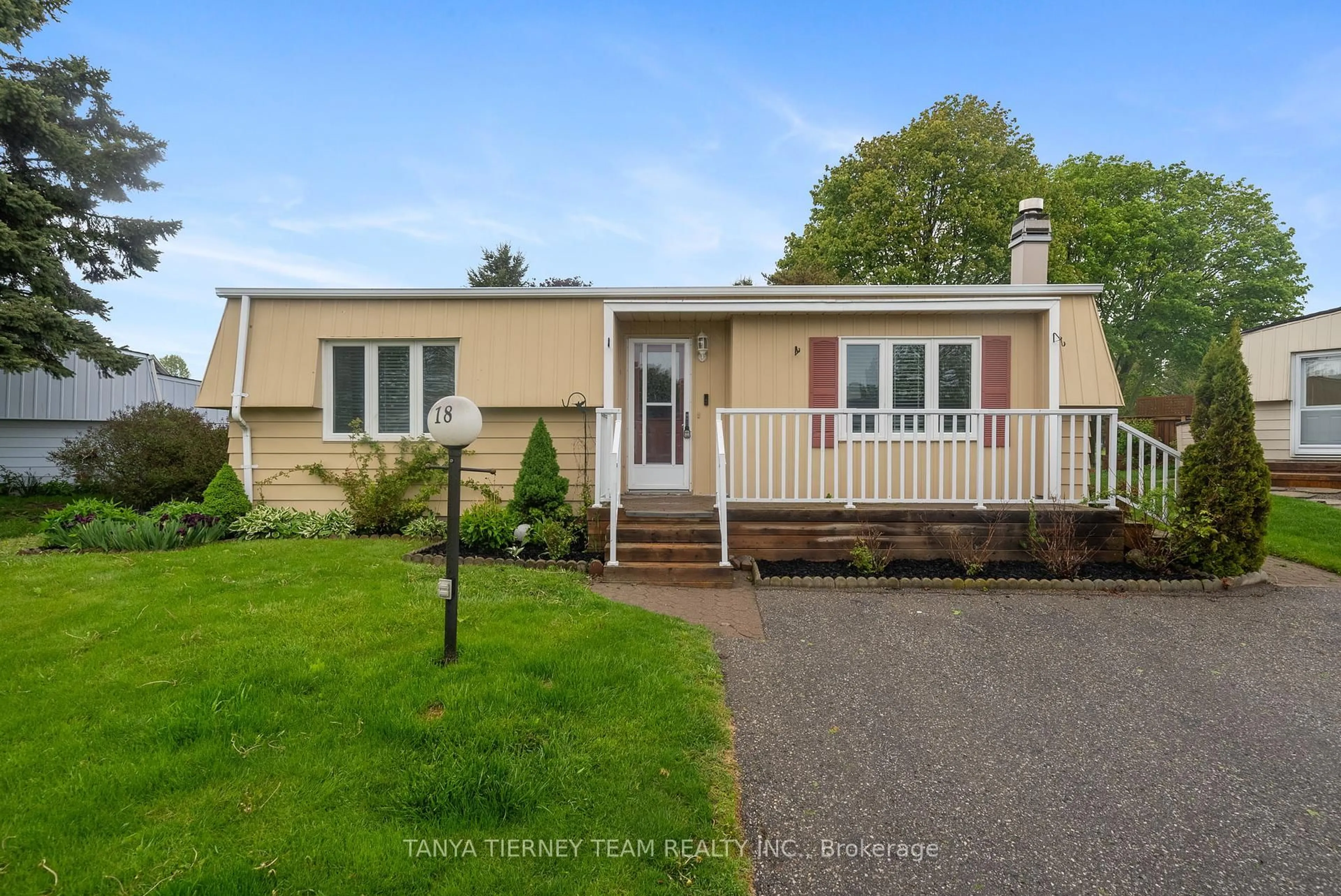 Home with vinyl exterior material, street for 18 The Cove Rd, Clarington Ontario L1B 1B9