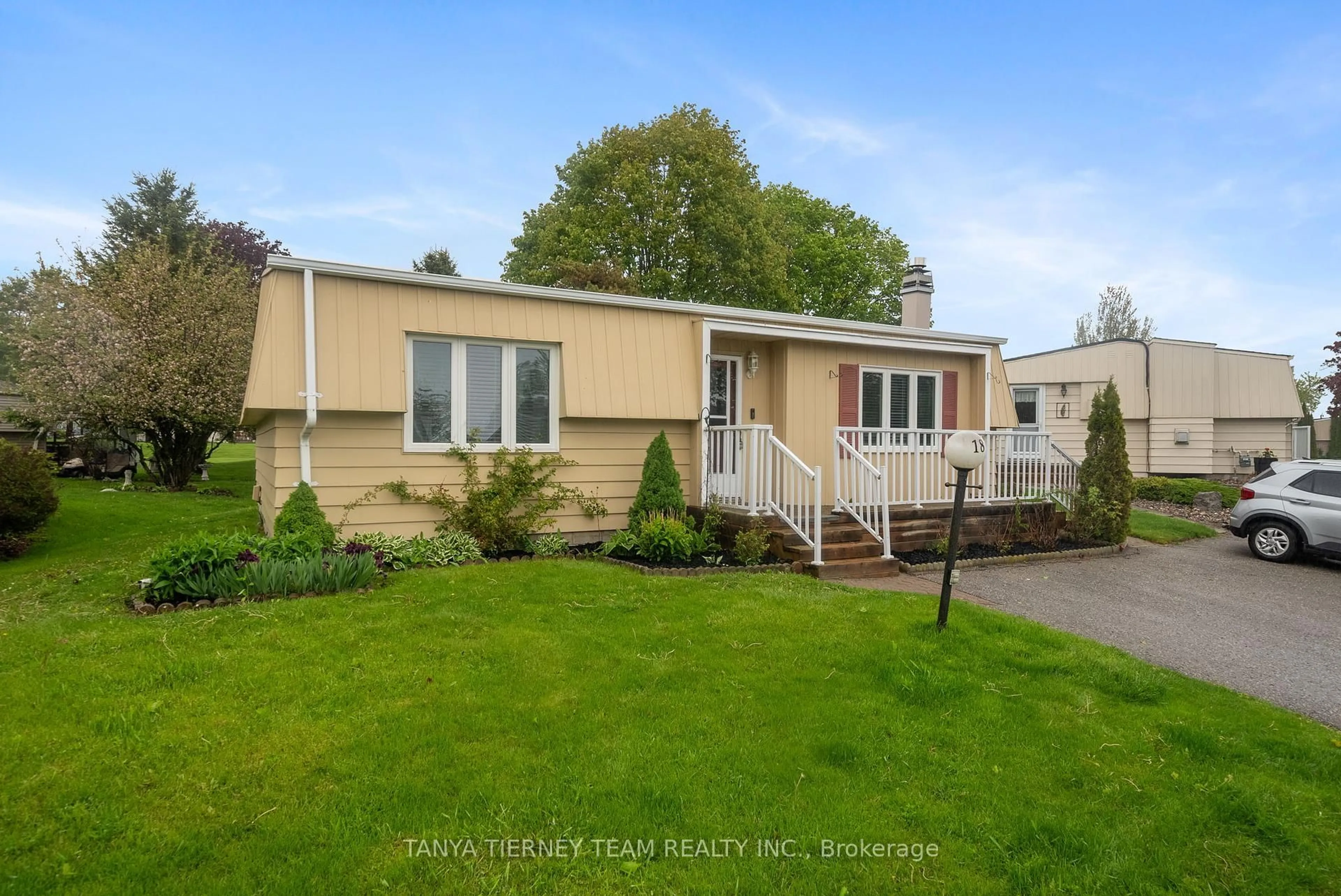 Home with vinyl exterior material, street for 18 The Cove Rd, Clarington Ontario L1B 1B9