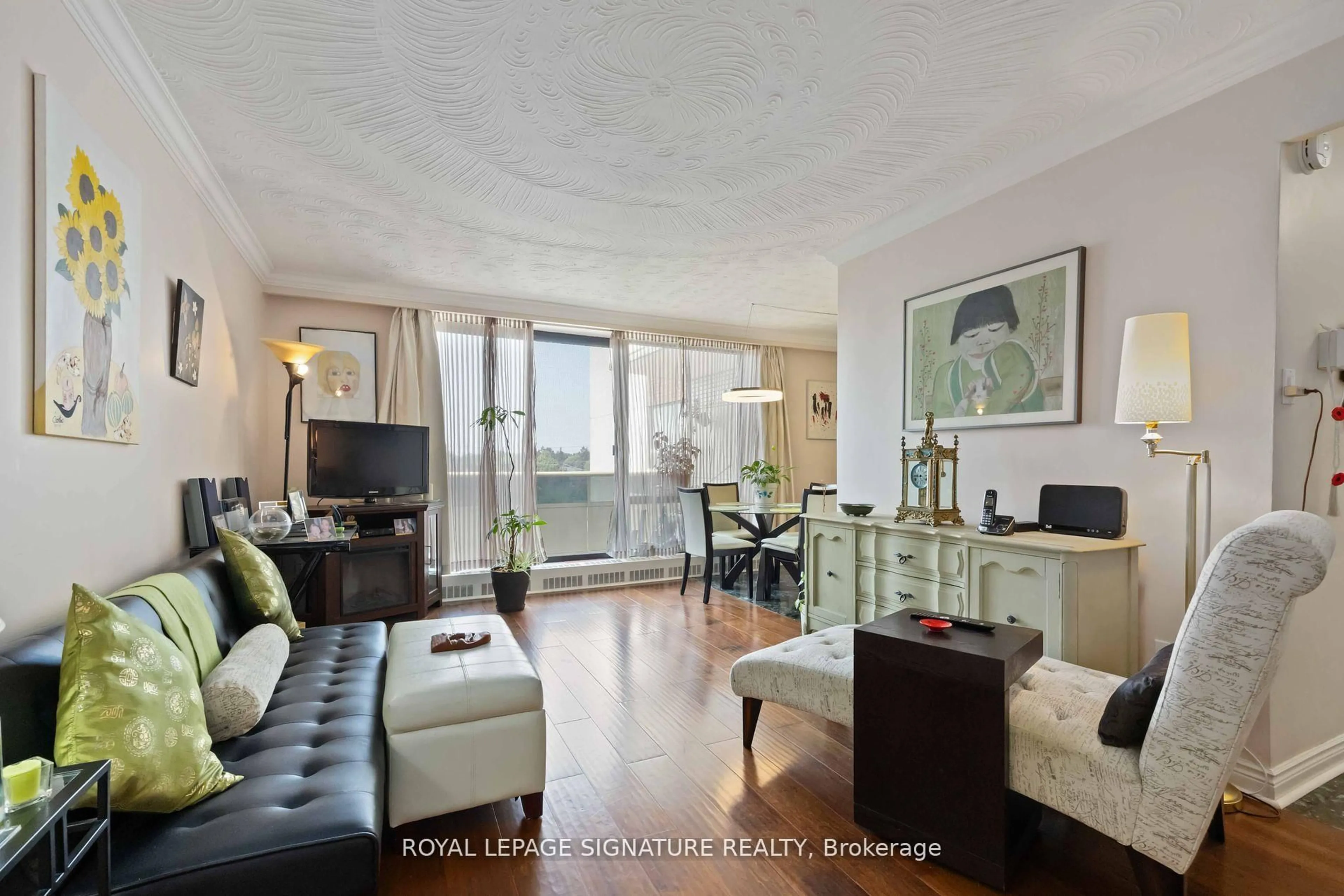 Living room with furniture, wood/laminate floor for 921 Midland Ave #502, Toronto Ontario M1K 4G2