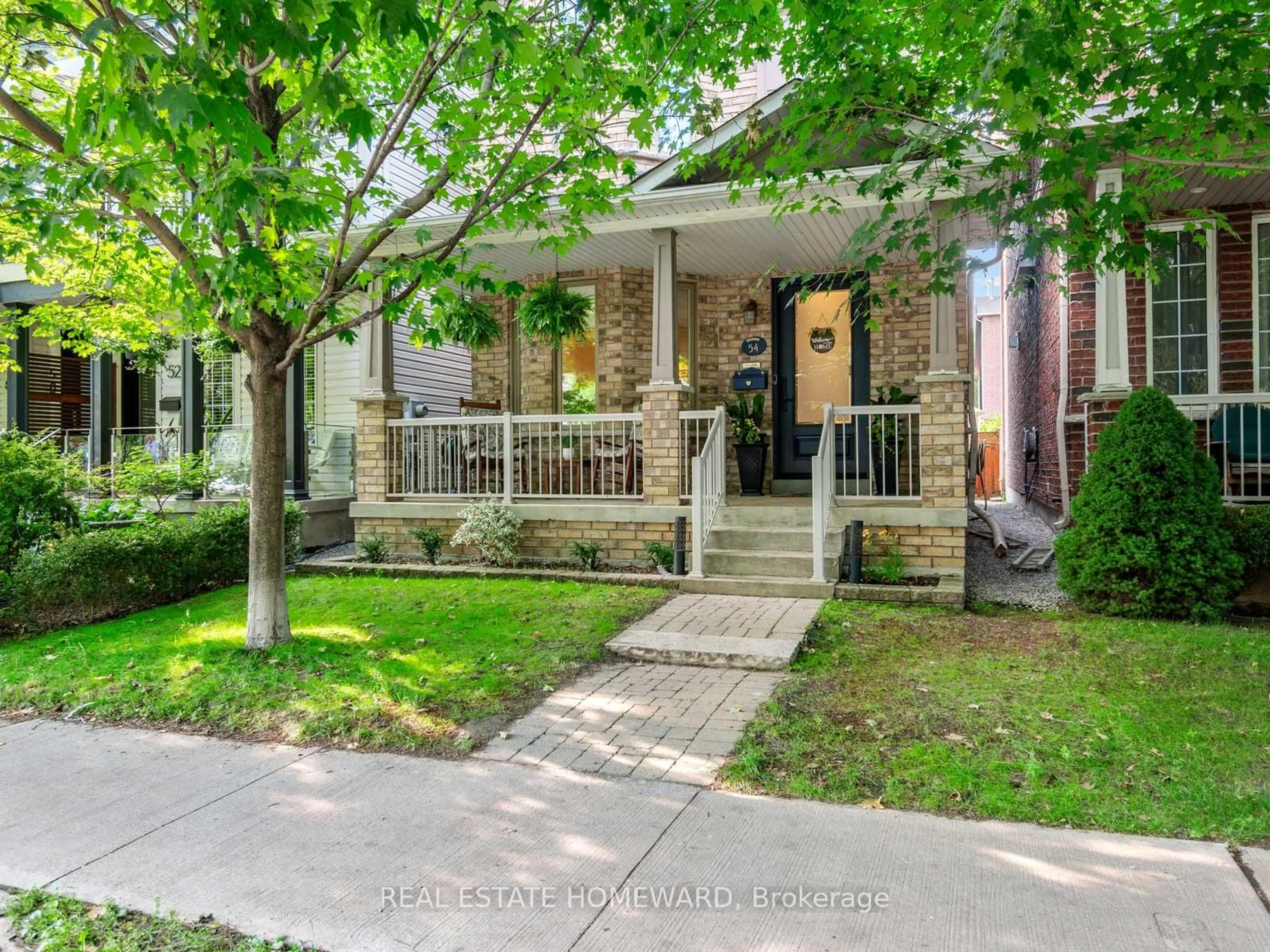 Home with brick exterior material, street for 54 Crossovers St, Toronto Ontario M4E 3X4