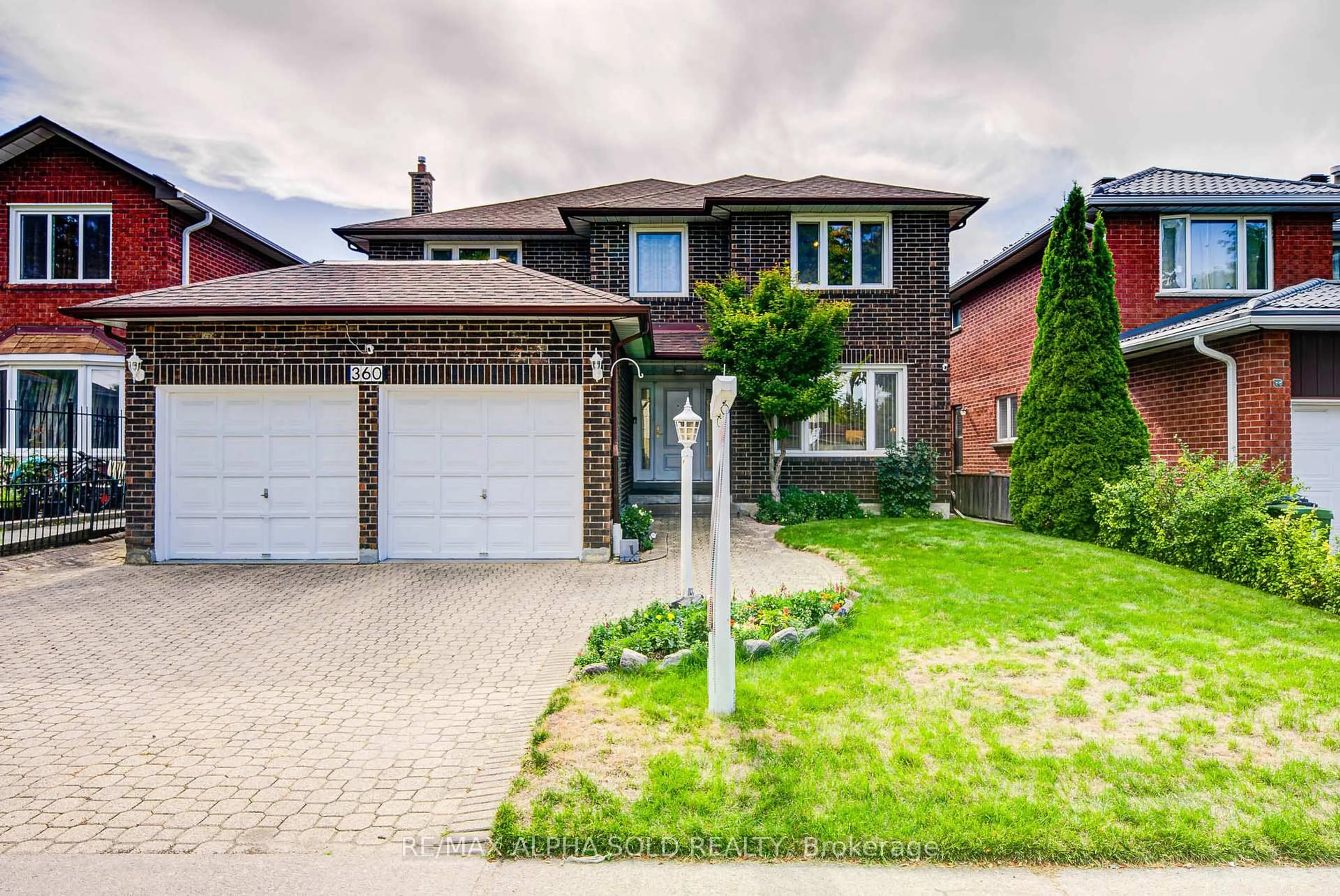 Home with brick exterior material, street for 360 Goldhawk Tr, Toronto Ontario M1V 4G1