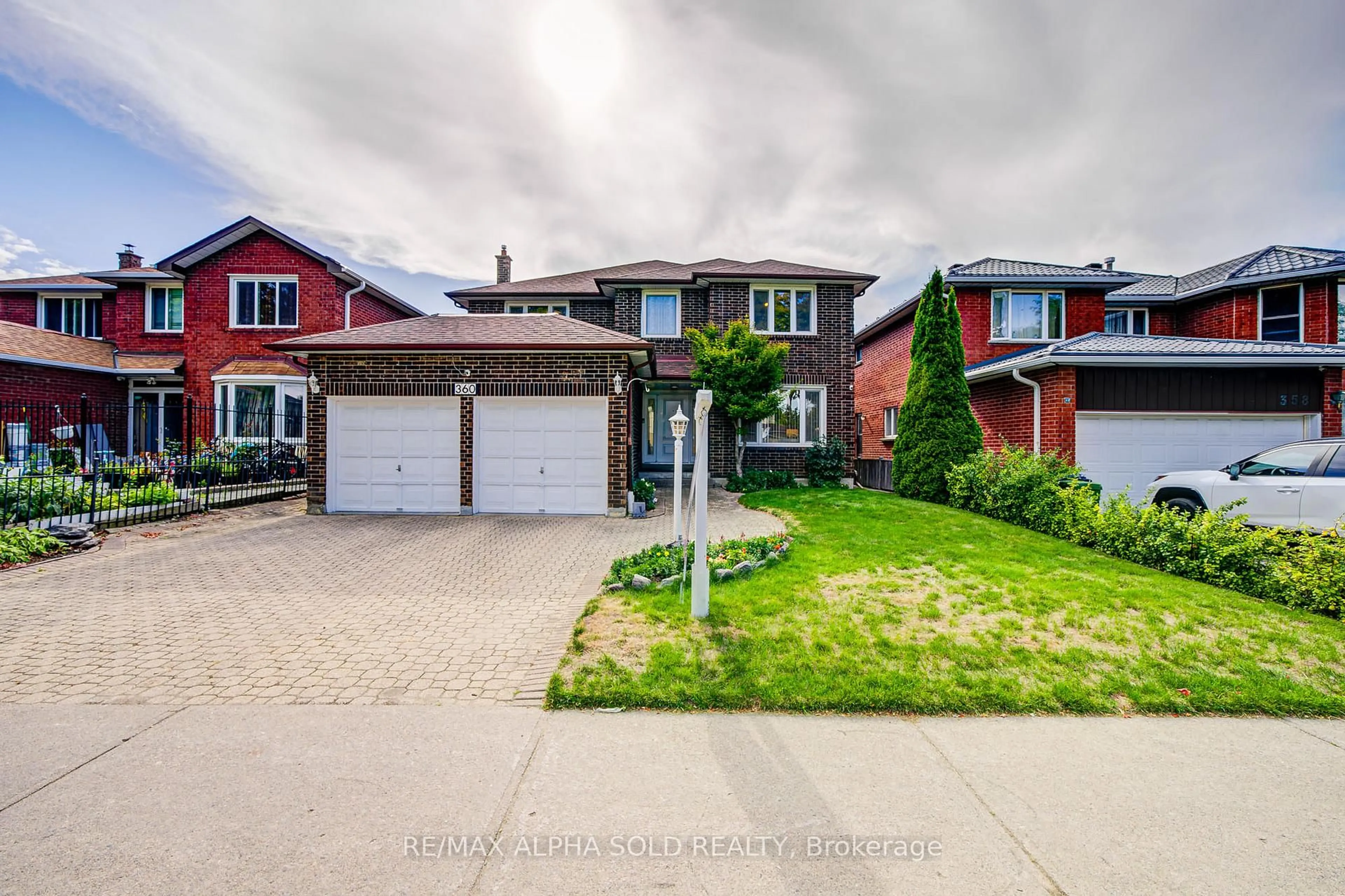 Home with brick exterior material, street for 360 Goldhawk Tr, Toronto Ontario M1V 4G1