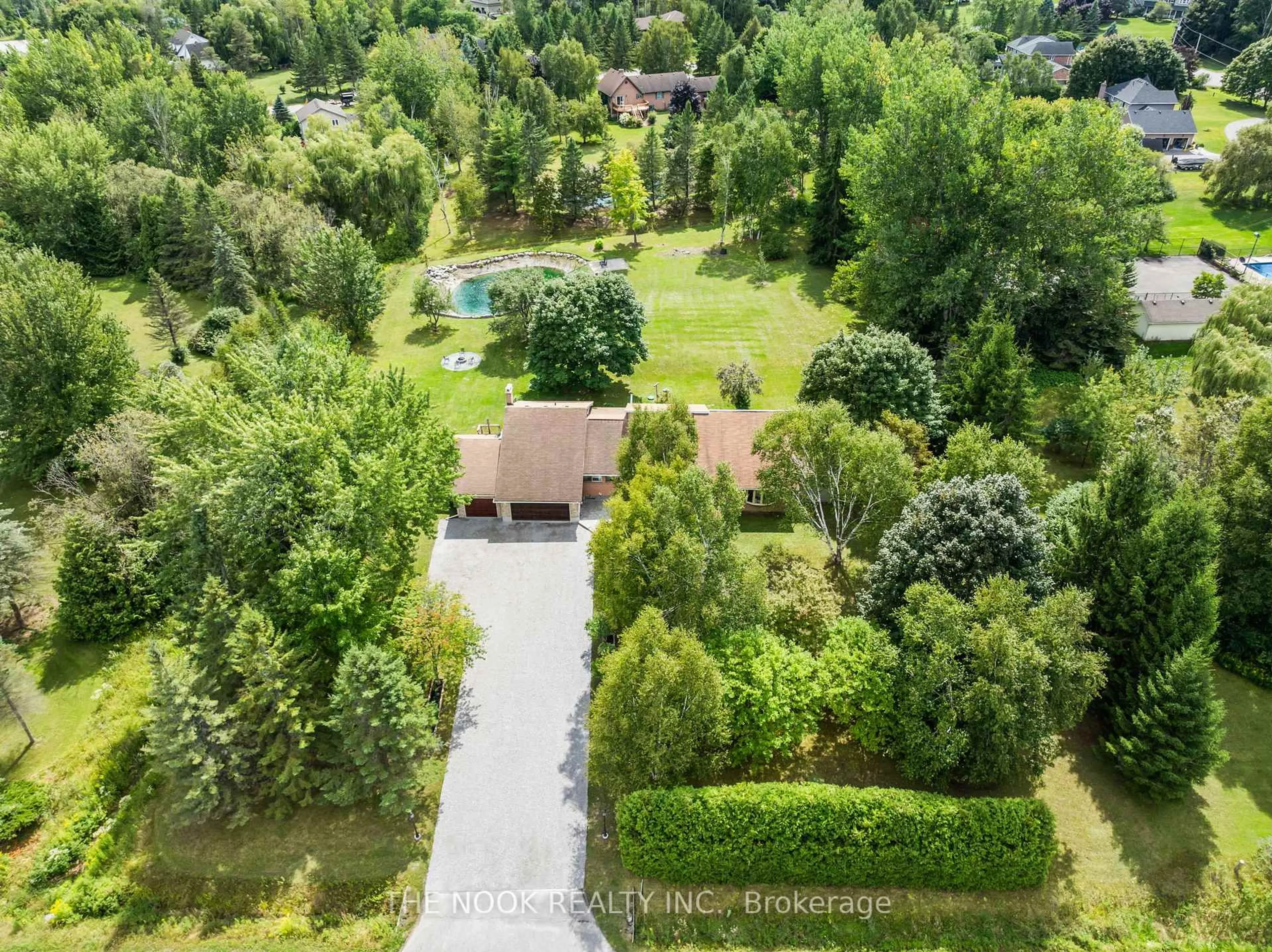 A pic from outside/outdoor area/front of a property/back of a property/a pic from drone, forest/trees view for 10 Stone Sound, Scugog Ontario L9L 1P5