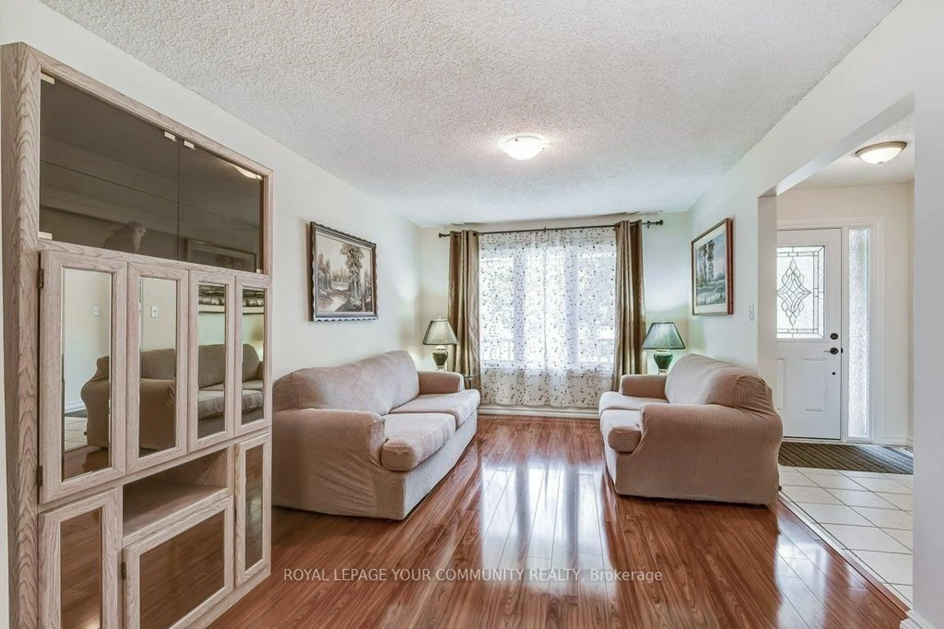 Living room with furniture, wood/laminate floor for 36 Stirling Ave, Clarington Ontario L1E 1X5