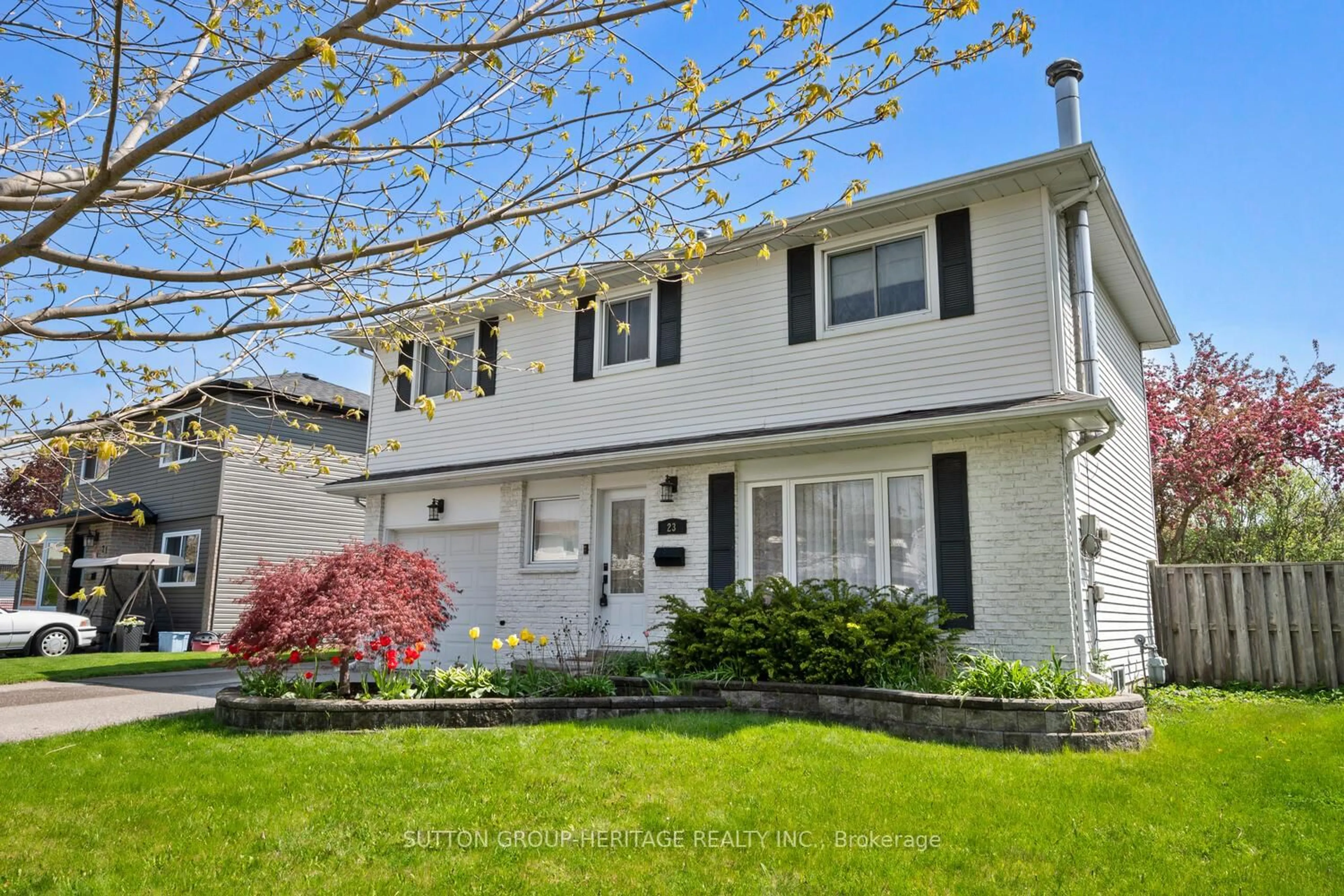 Home with vinyl exterior material, street for 23 Agate Rd, Ajax Ontario L1S 3J7
