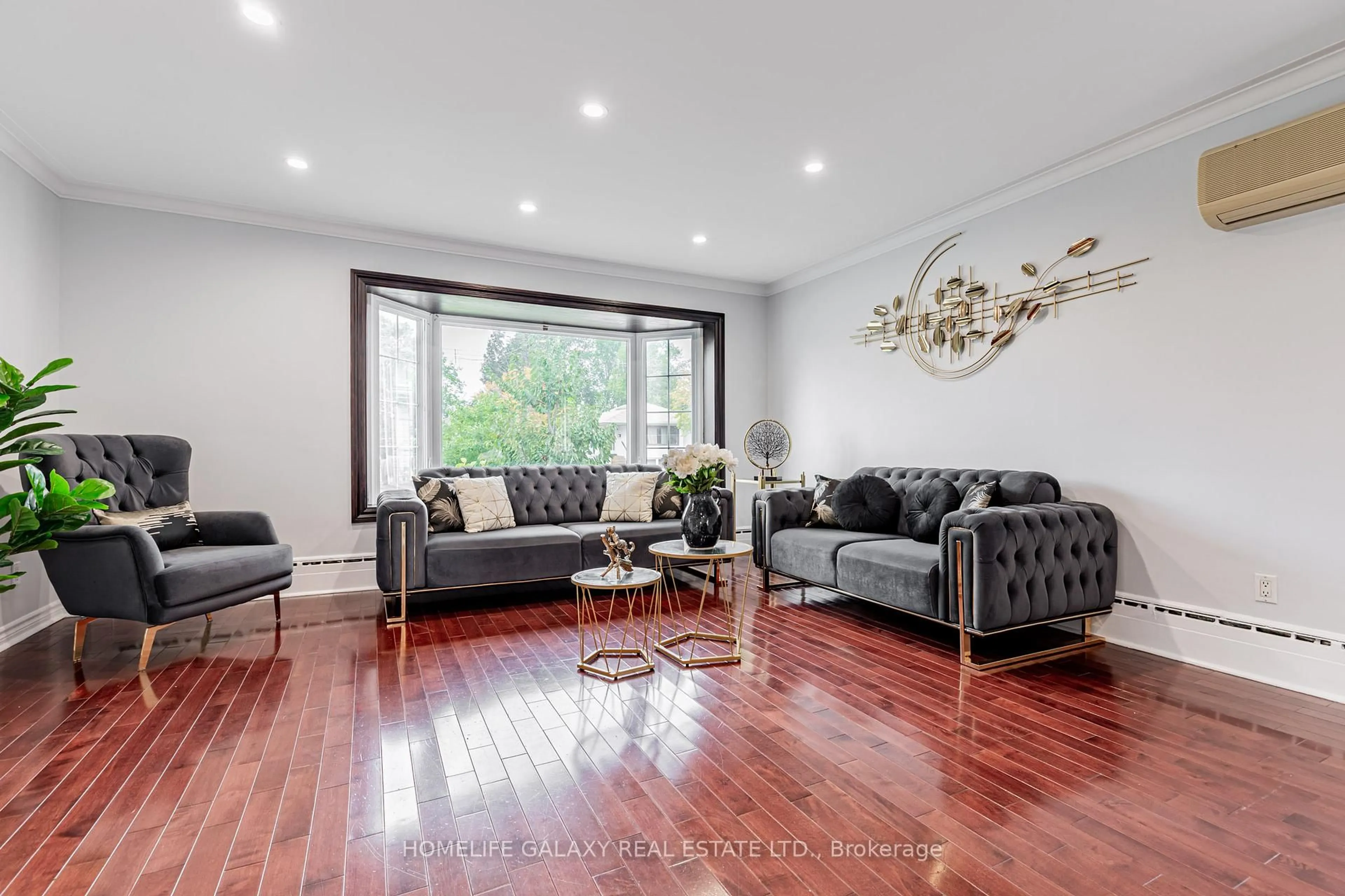 Living room with furniture, wood/laminate floor for 43 Larkhall Ave, Toronto Ontario M1J 1V2