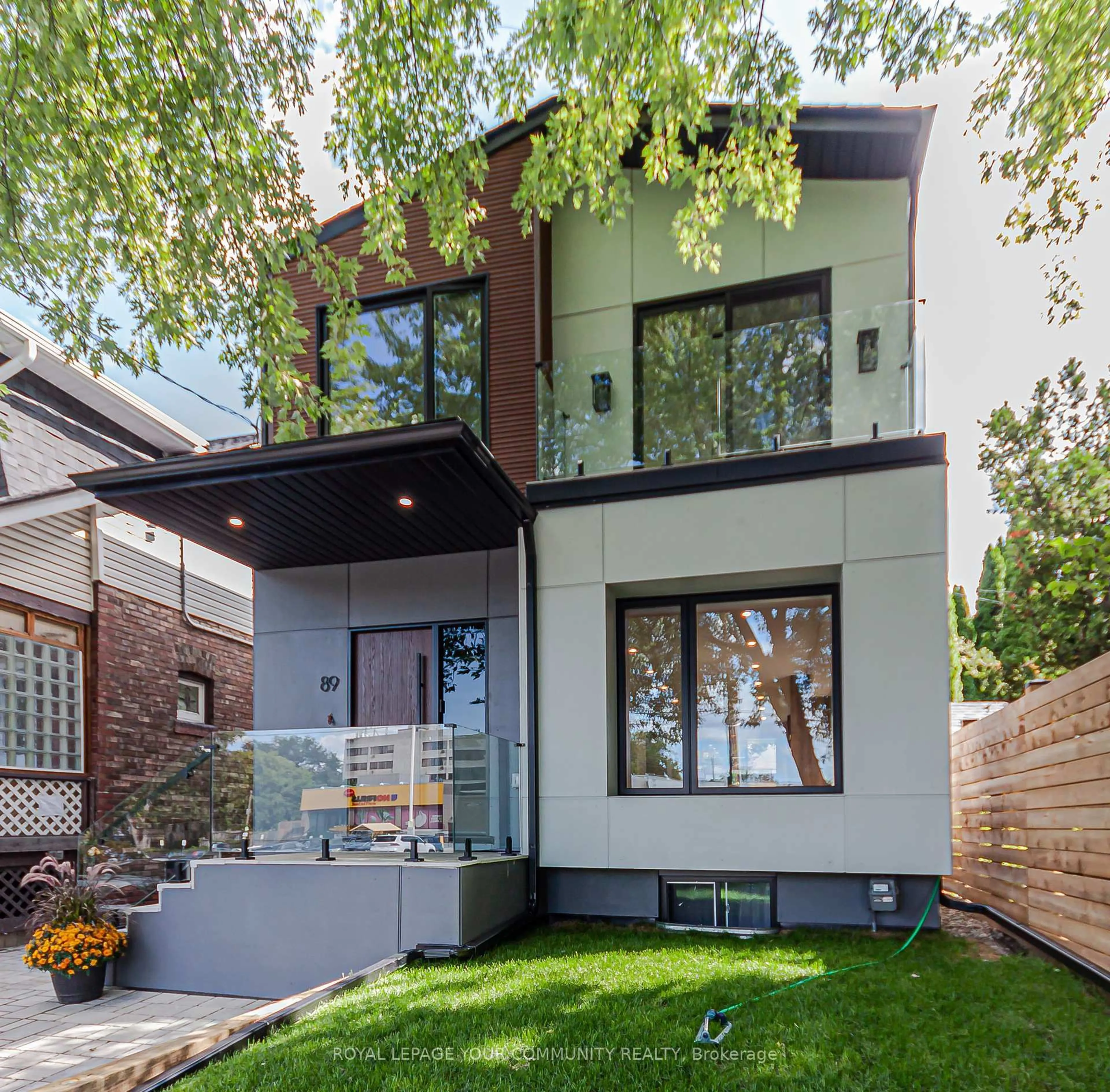 Home with brick exterior material, street for 89 Gainsborough Rd, Toronto Ontario M4L 3C3