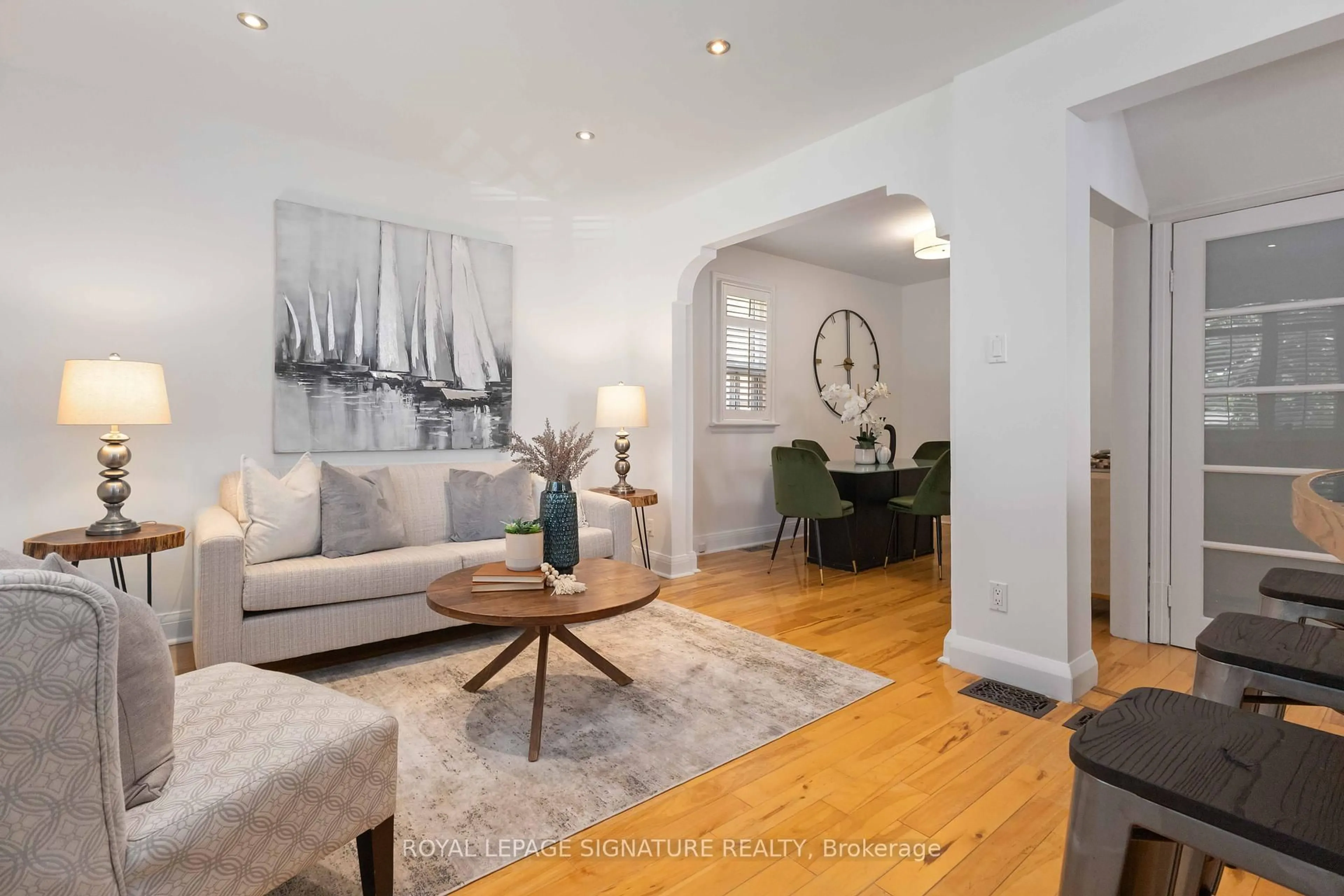 Living room with furniture, wood/laminate floor for 83 Harewood Ave, Toronto Ontario M1M 2R4