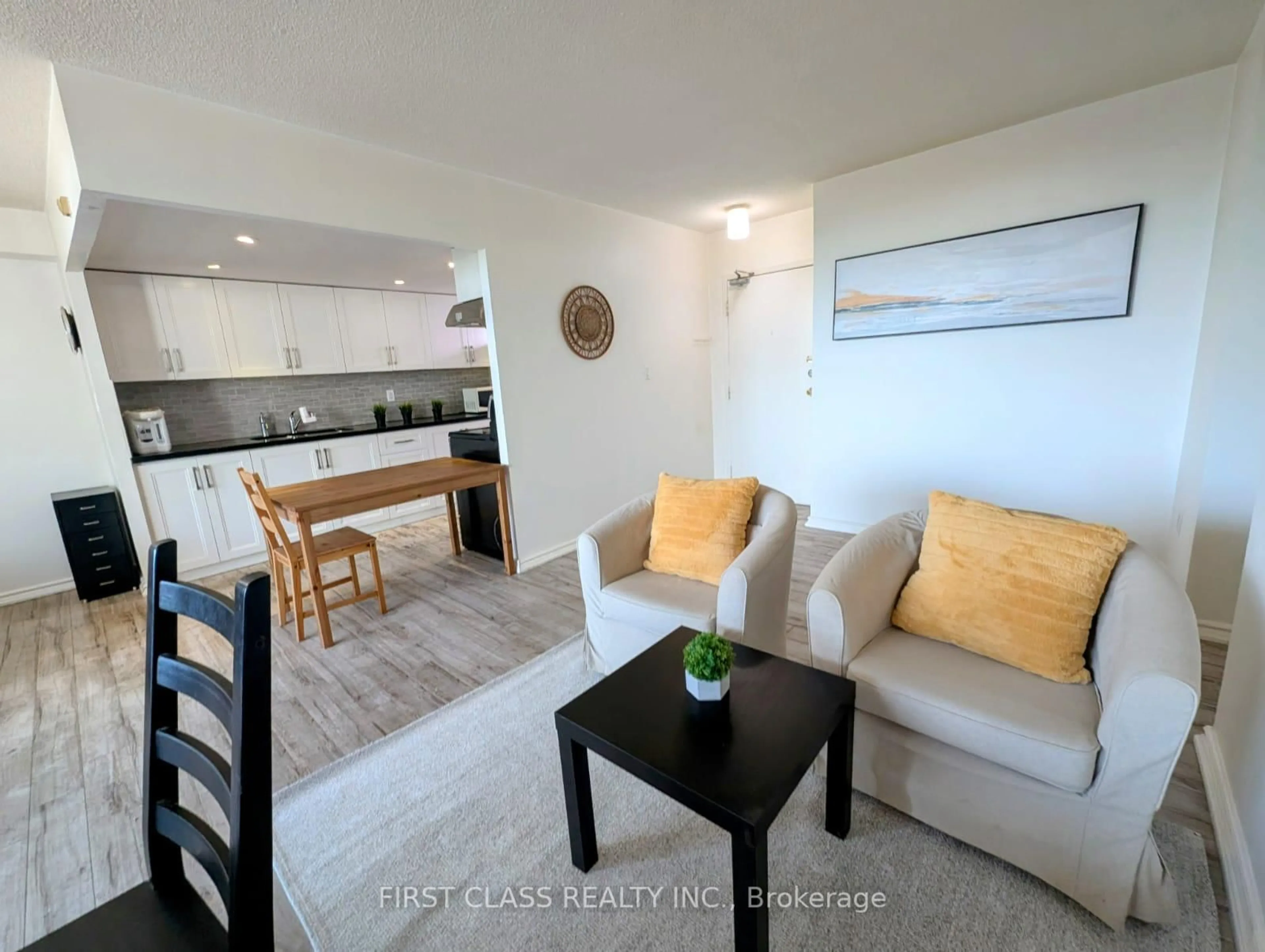Living room with furniture, unknown for 1250 Bridletowne Circ #310, Toronto Ontario M1W 2V1