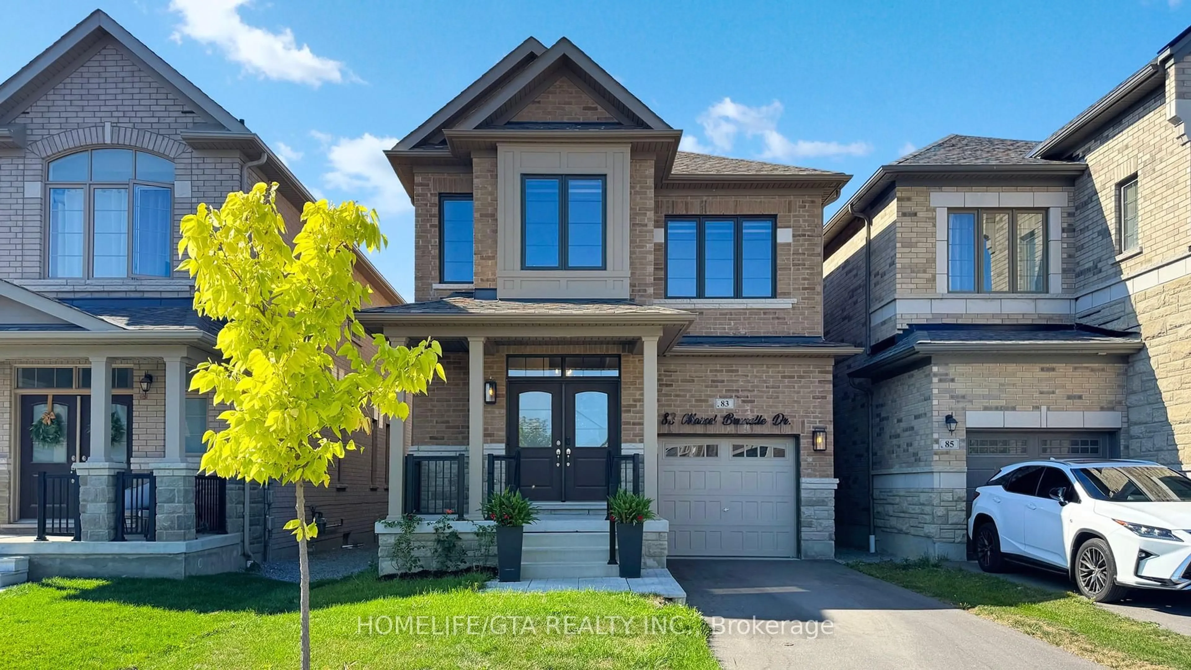 Home with brick exterior material, street for 83 Marcel Brunelle Dr, Whitby Ontario L1P 0G9
