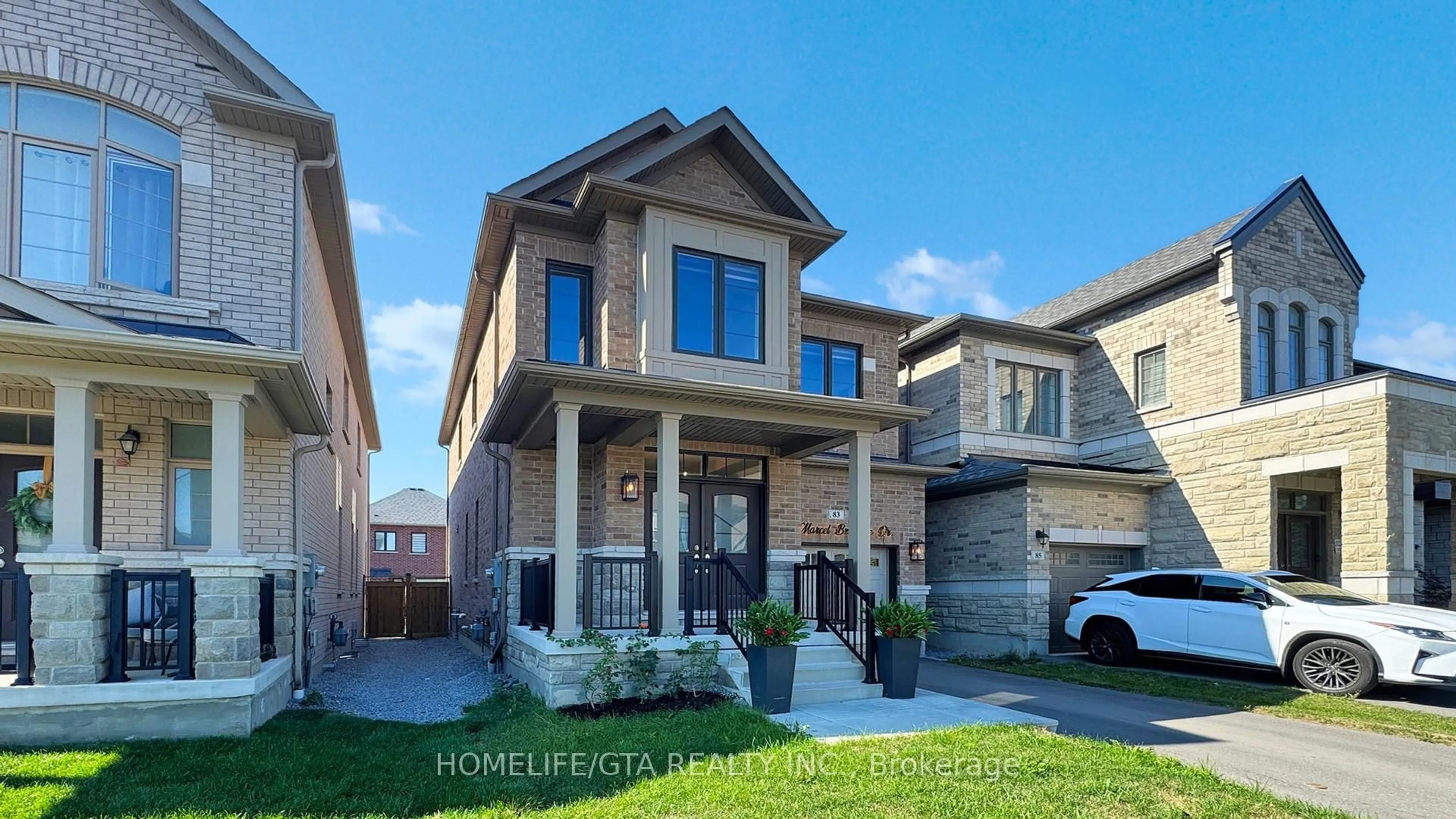 Home with brick exterior material, street for 83 Marcel Brunelle Dr, Whitby Ontario L1P 0G9
