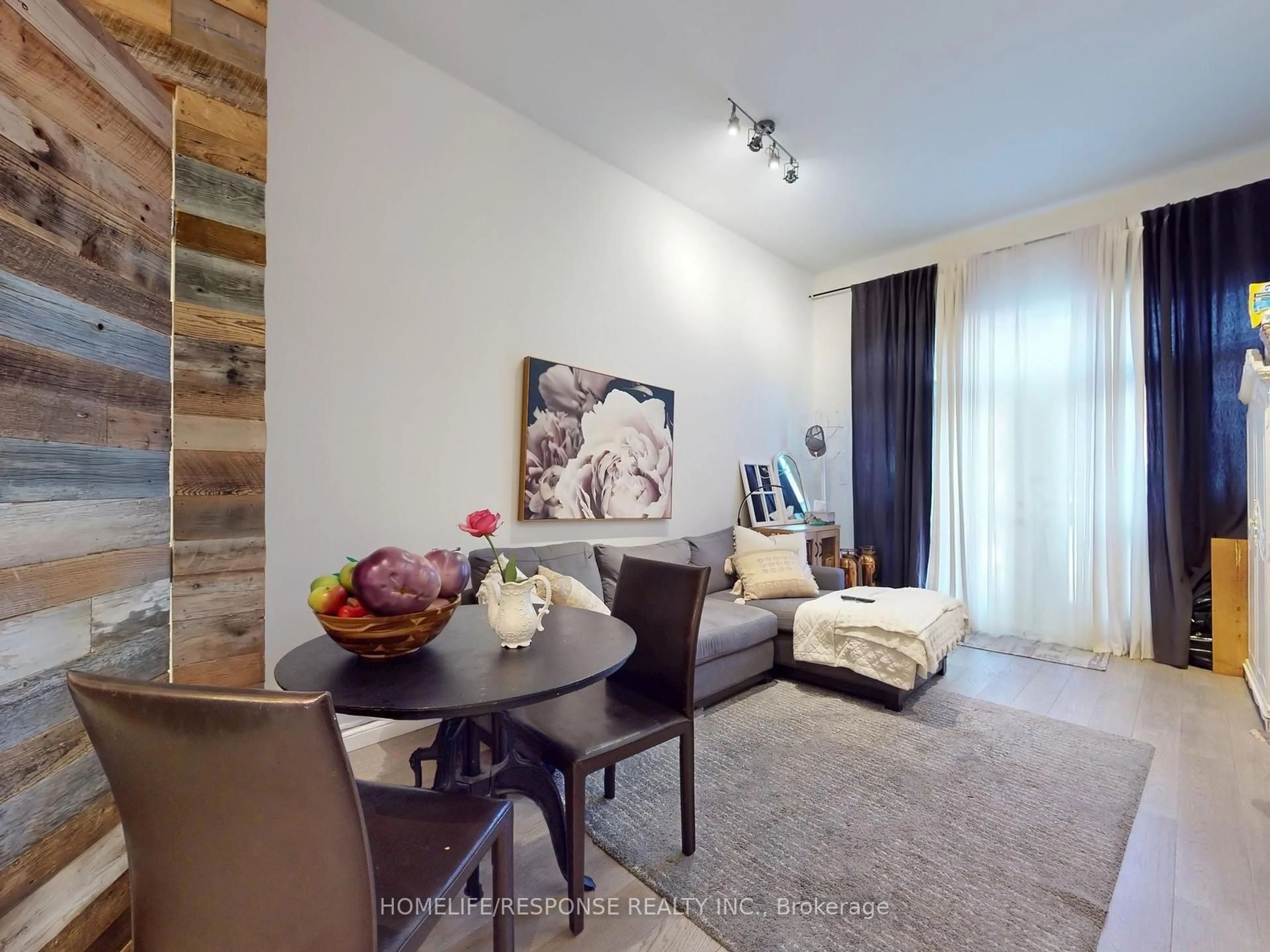 Living room with furniture, unknown for 1095 DUNDAS St, Toronto Ontario M4M 1R9