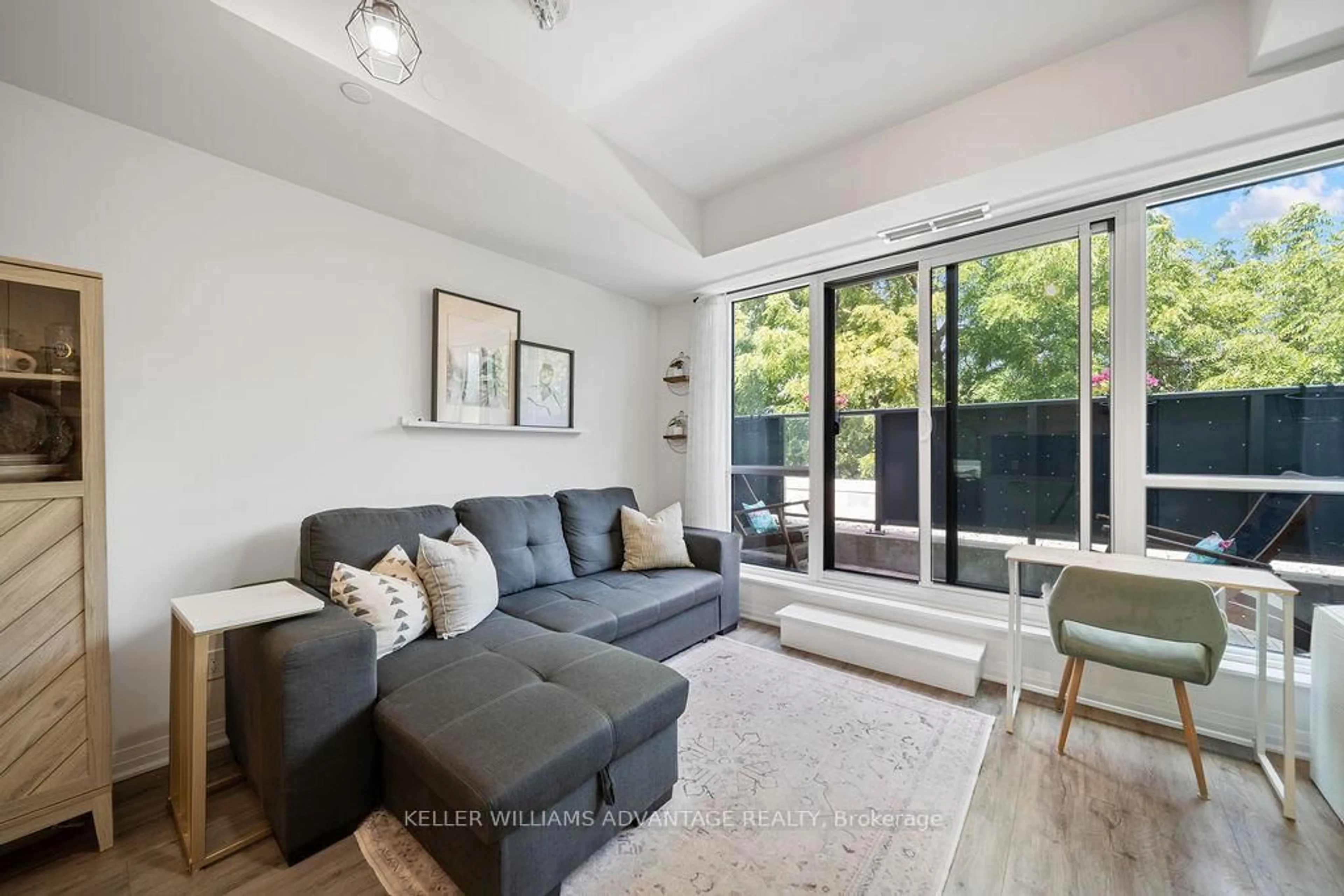 Living room with furniture, unknown for 1630 Queen St #421, Toronto Ontario M4L 0B3