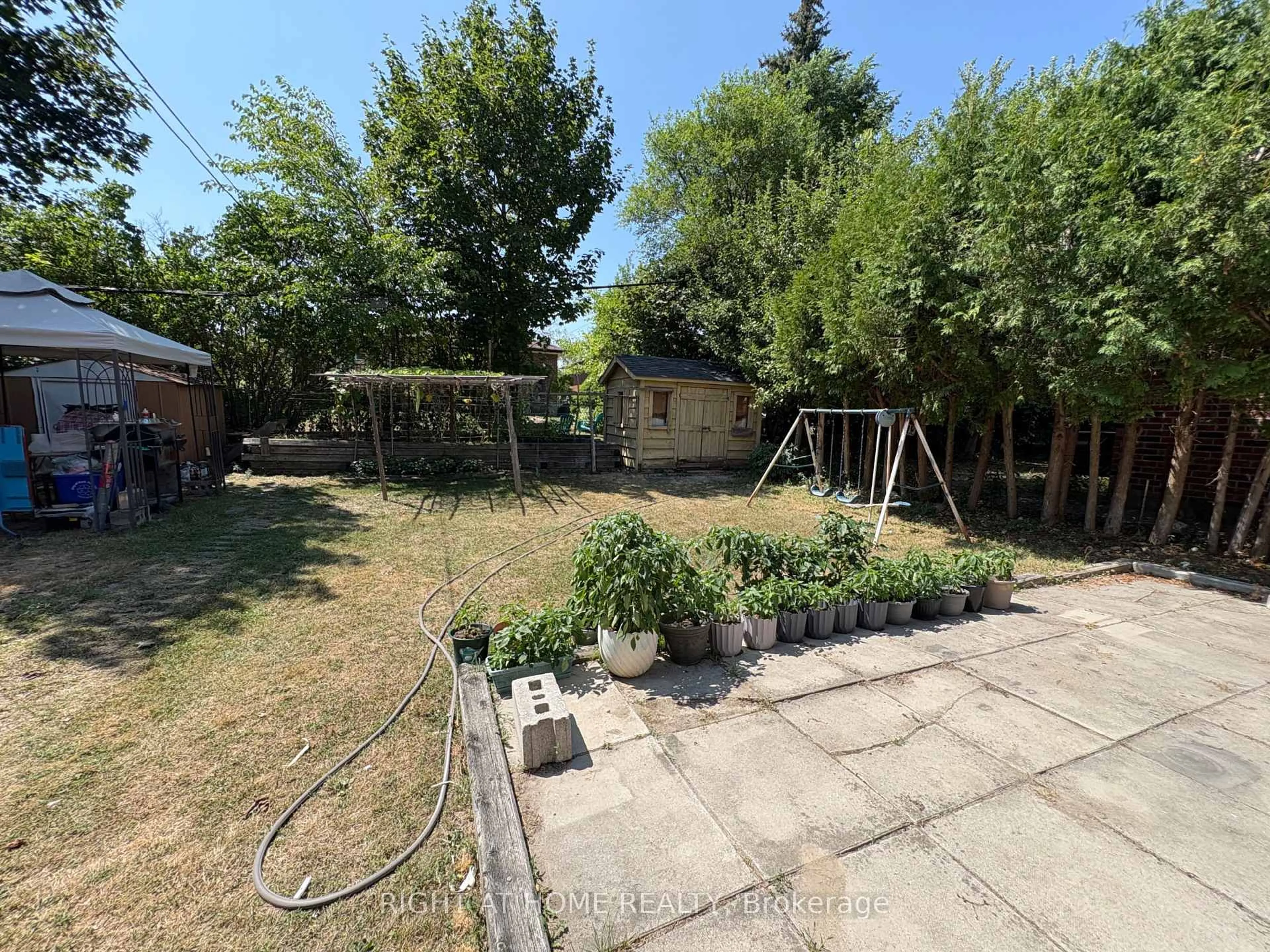 A pic from outside/outdoor area/front of a property/back of a property/a pic from drone, street for 932 Midland Ave, Toronto Ontario M1K 4G3