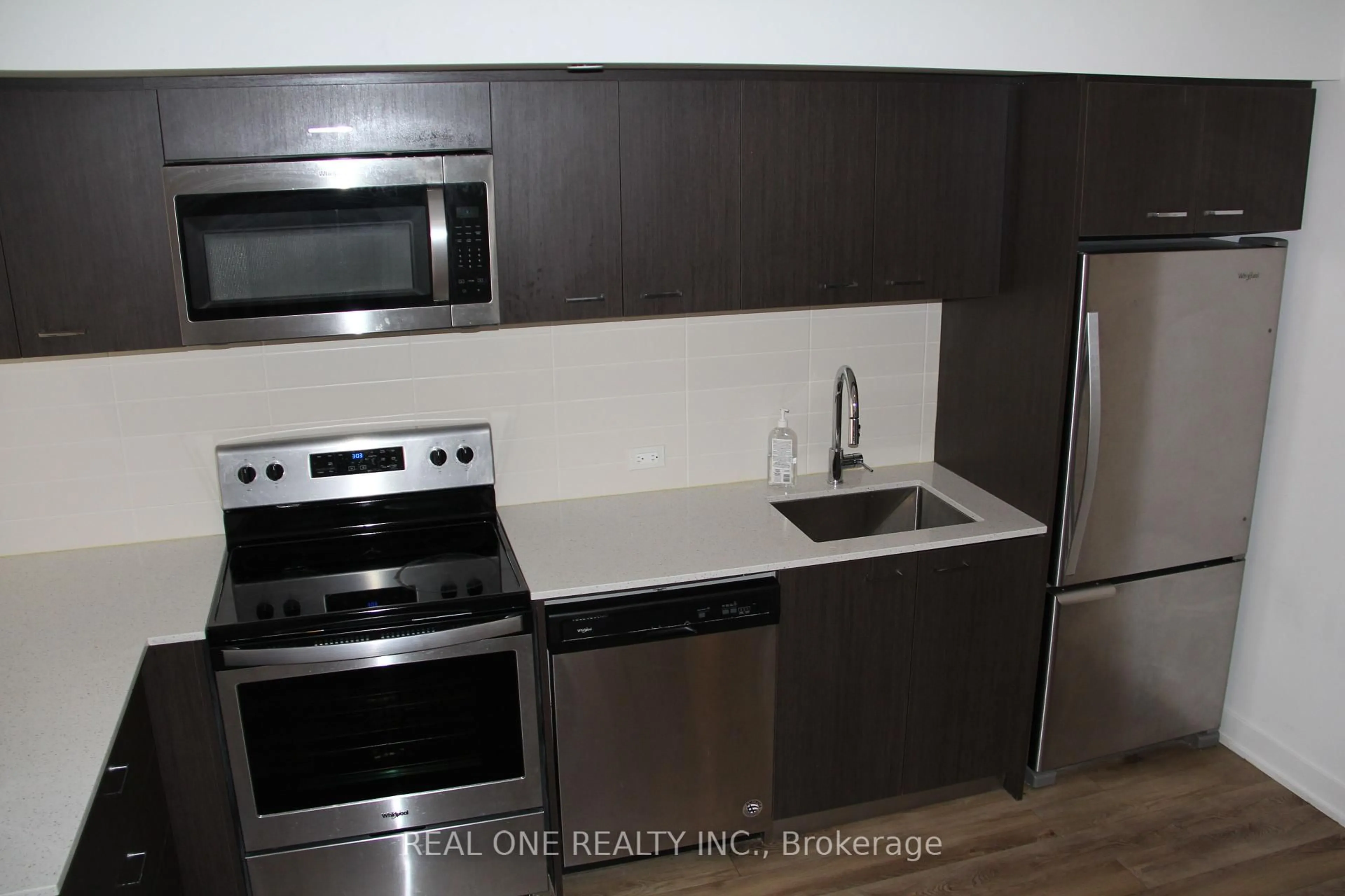 Standard kitchen, wood/laminate floor for 2100 Bridletowne Circ #318, Toronto Ontario M1W 2L1