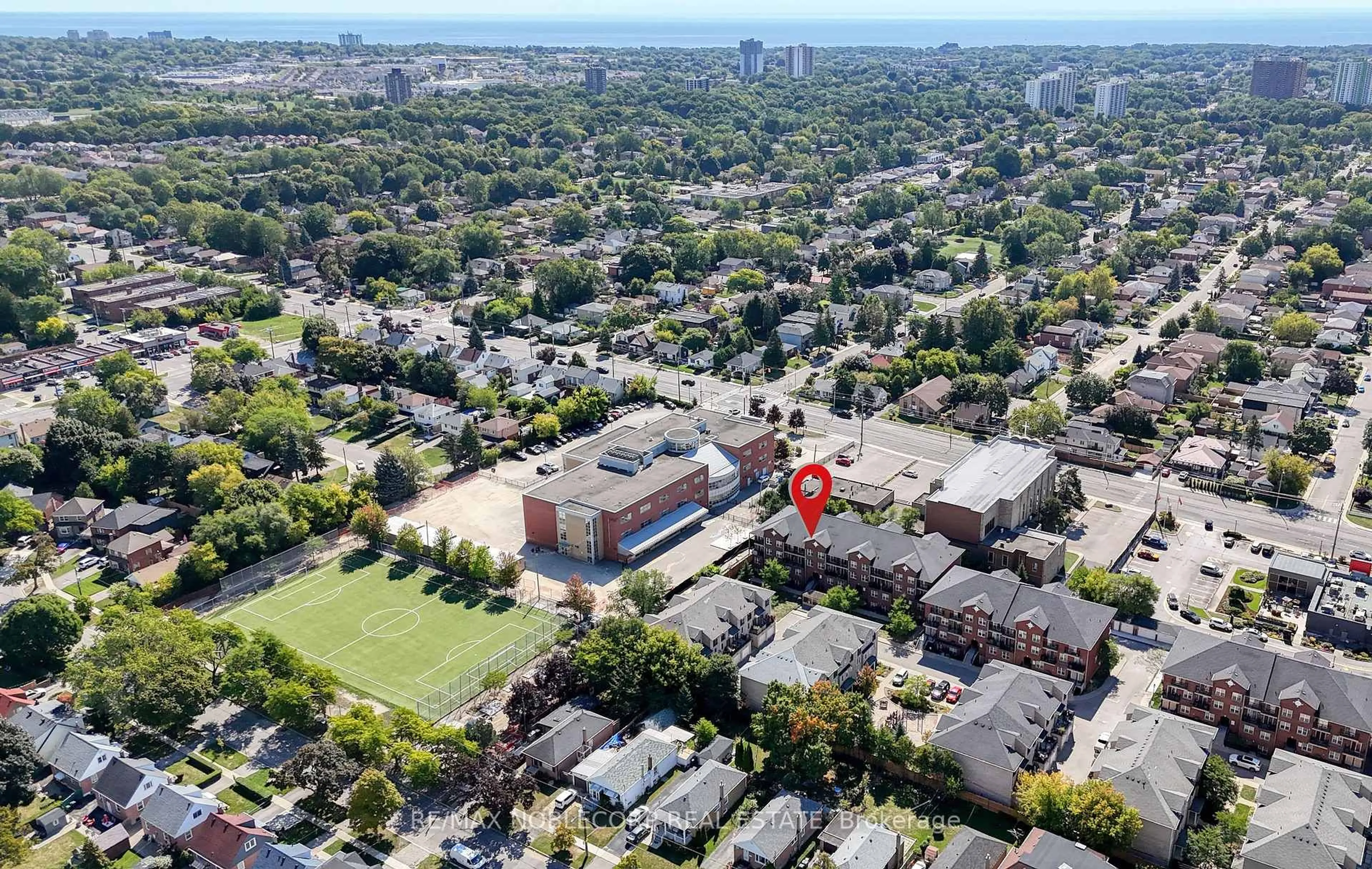 A pic from outside/outdoor area/front of a property/back of a property/a pic from drone, unknown for 45 Strangford Lane #311, Toronto Ontario M1L 0E5