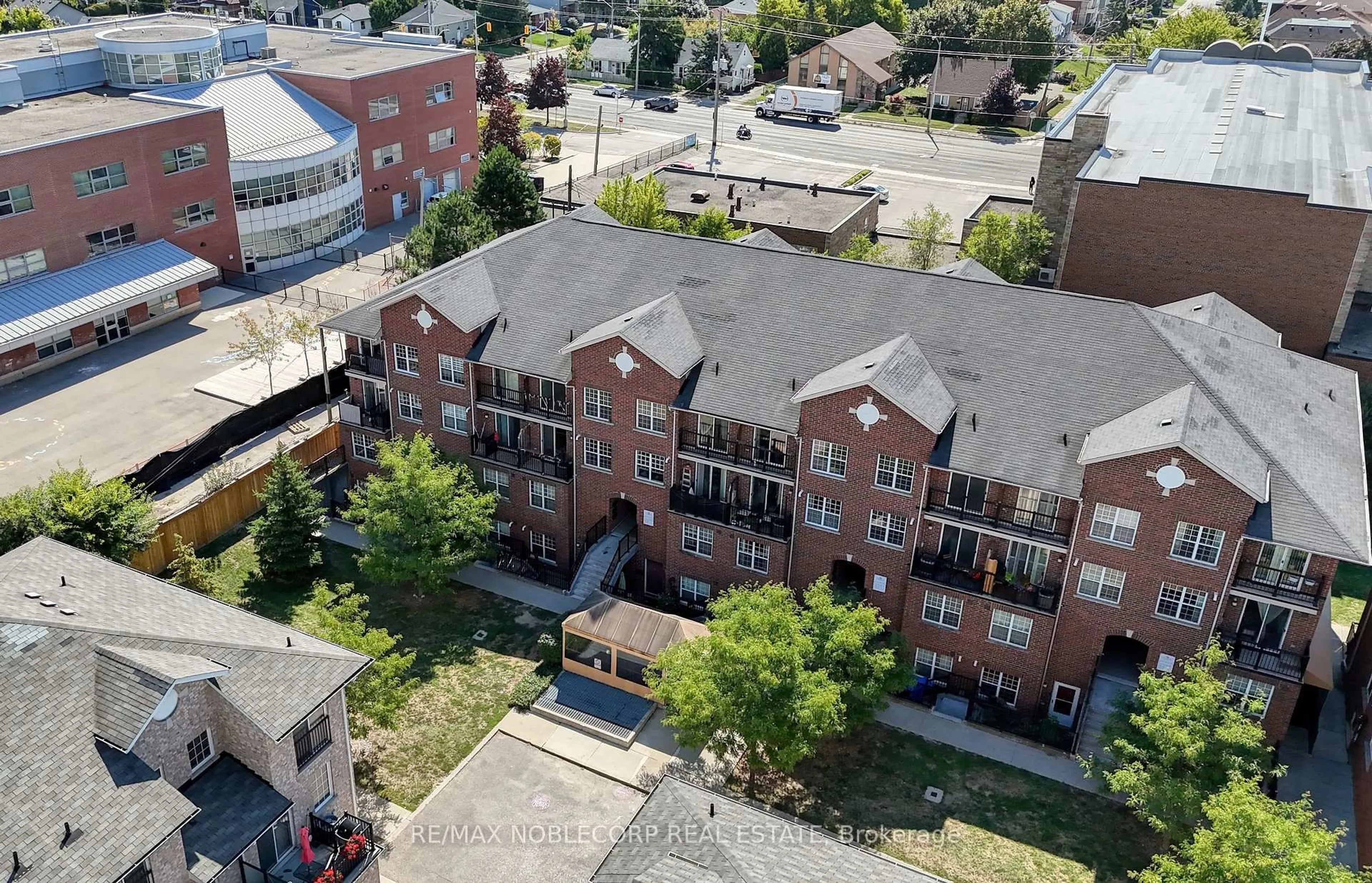 A pic from outside/outdoor area/front of a property/back of a property/a pic from drone, city buildings view from balcony for 45 Strangford Lane #311, Toronto Ontario M1L 0E5