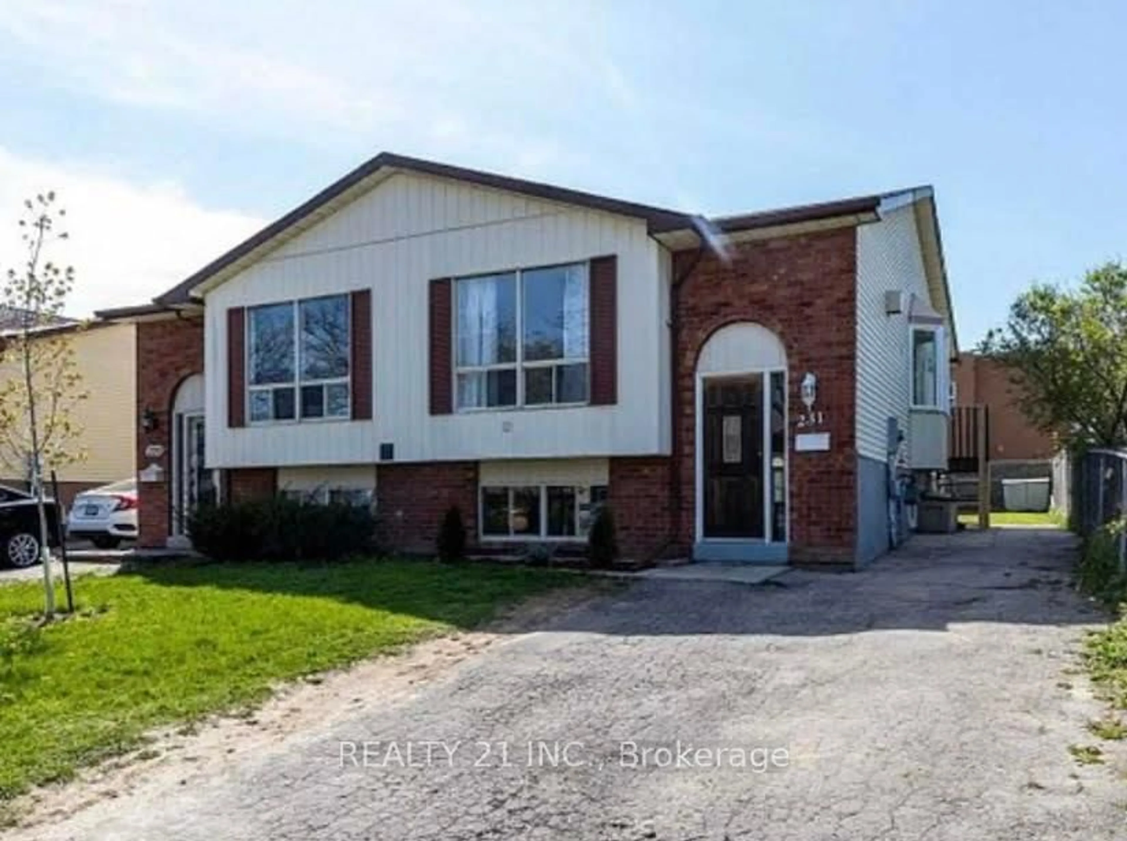 Home with brick exterior material, street for 231 Medina Crt, Oshawa Ontario L1J 7E1
