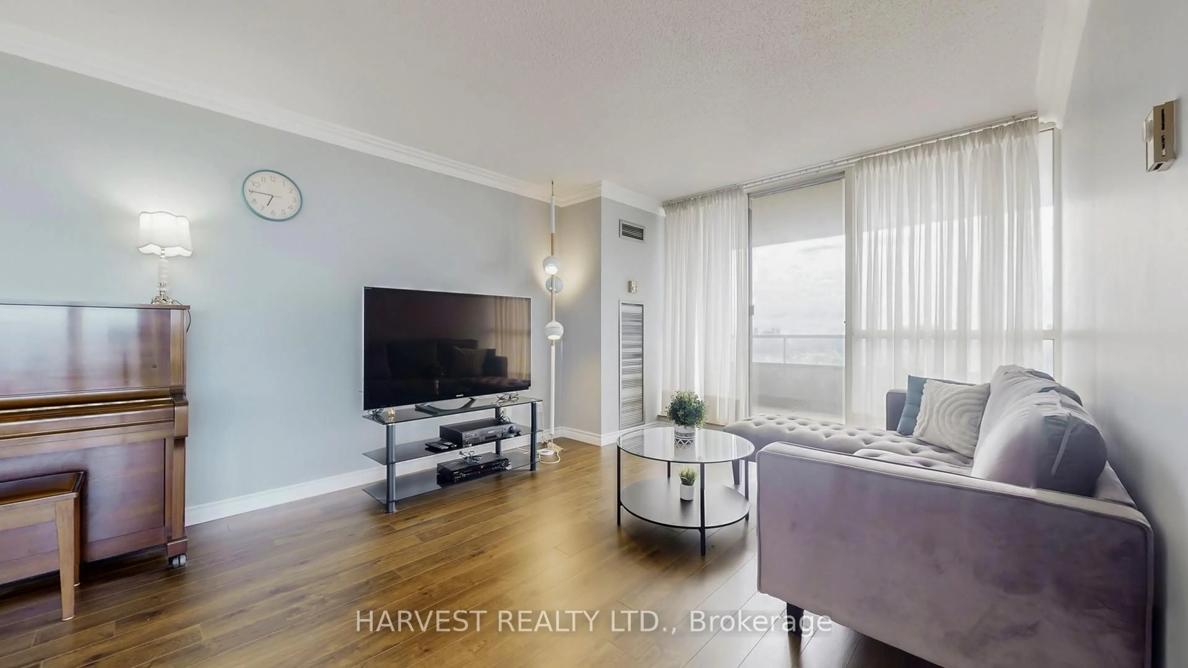 Living room with furniture, wood/laminate floor for 175 Bamburgh Circ #1703, Toronto Ontario M1W 3X8
