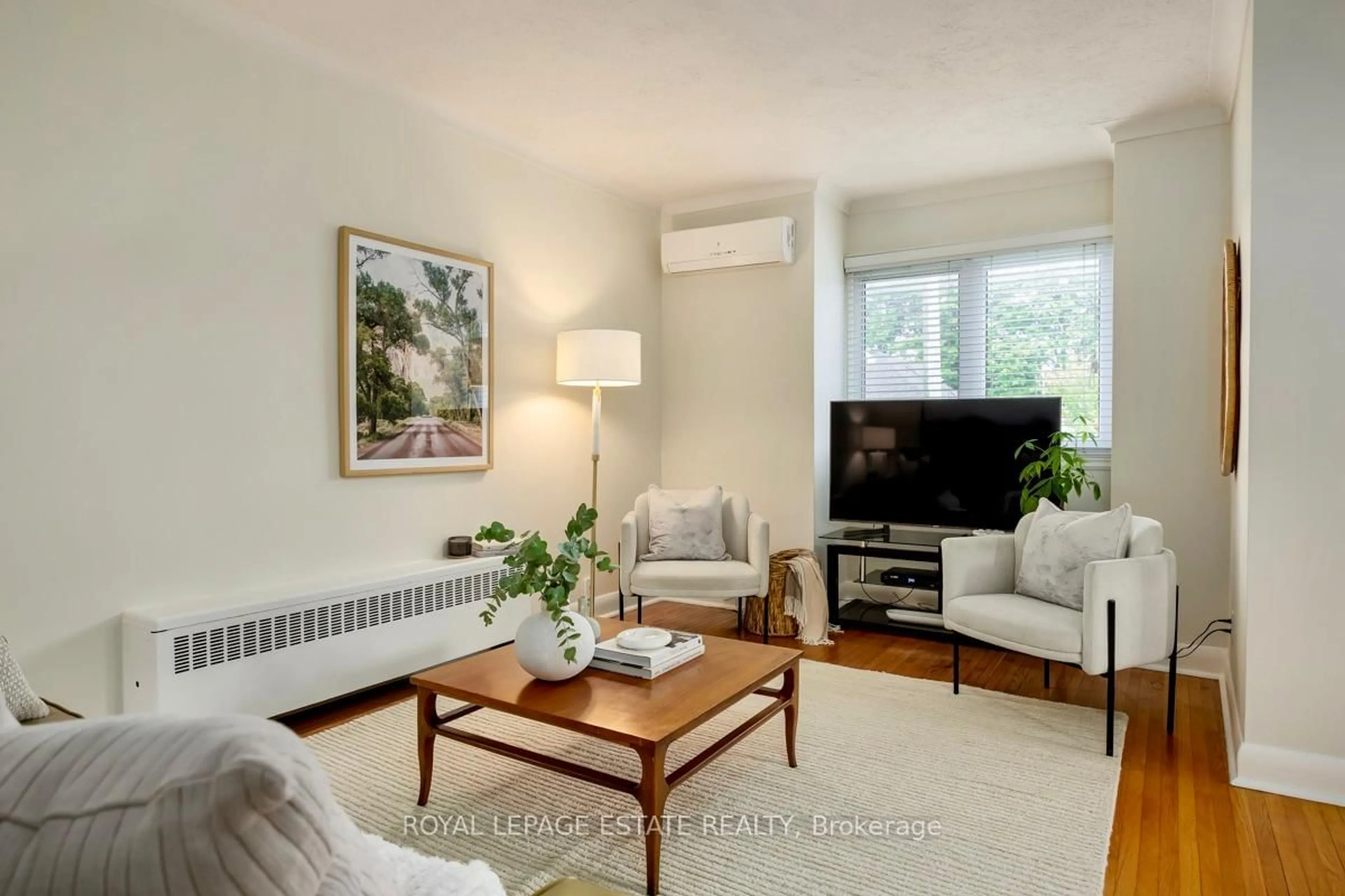 Living room with furniture, wood/laminate floor for 92 South Woodrow Blvd, Toronto Ontario M1N 3L7