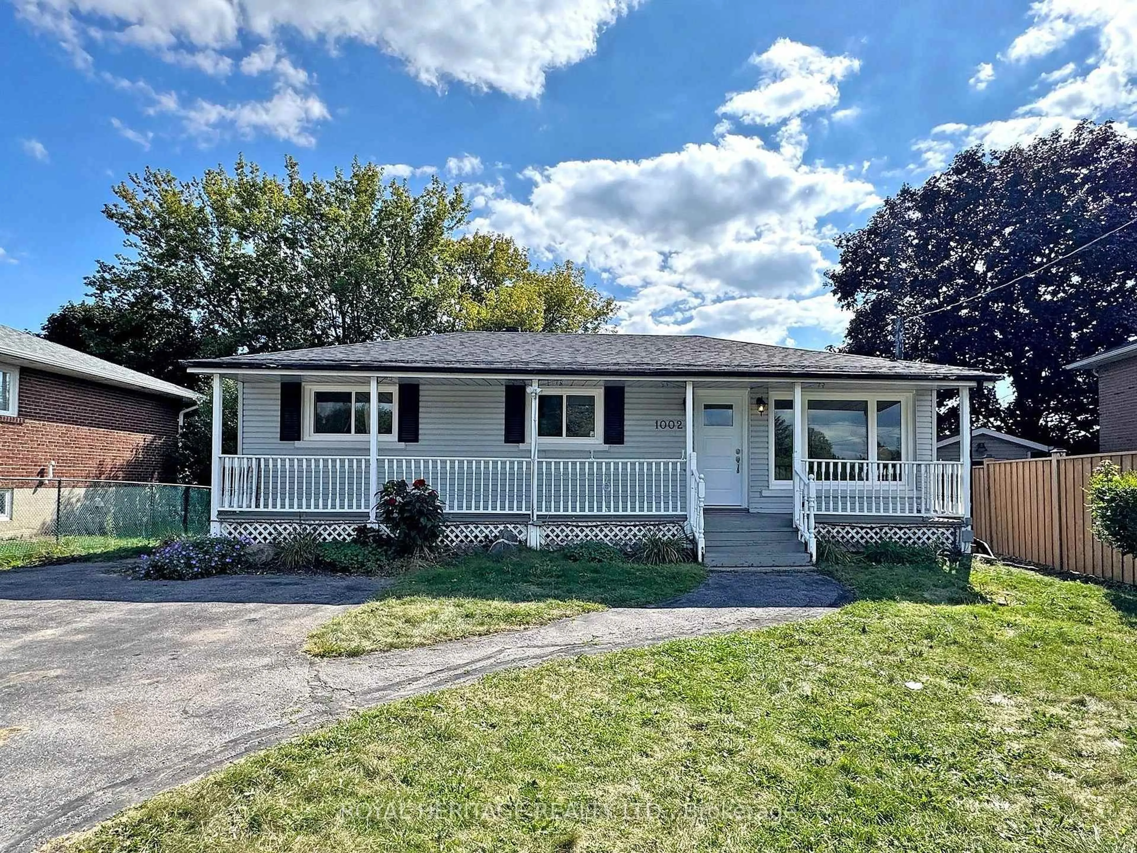 Home with vinyl exterior material, street for 1002 McCullough Dr, Whitby Ontario L1N 1C6