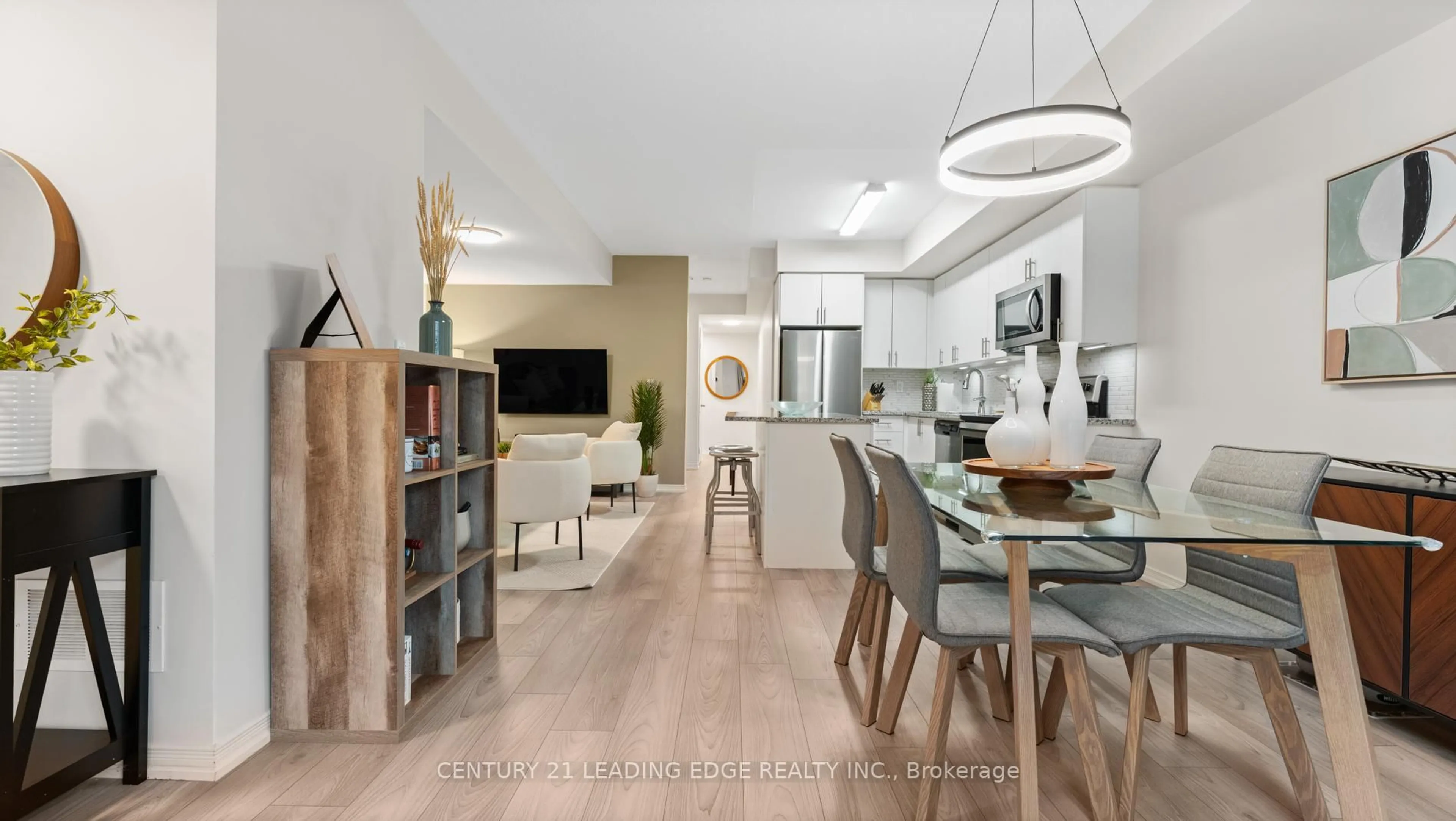 Open concept kitchen, wood/laminate floor for 8835 Sheppard Ave #112, Toronto Ontario M1B 5R7