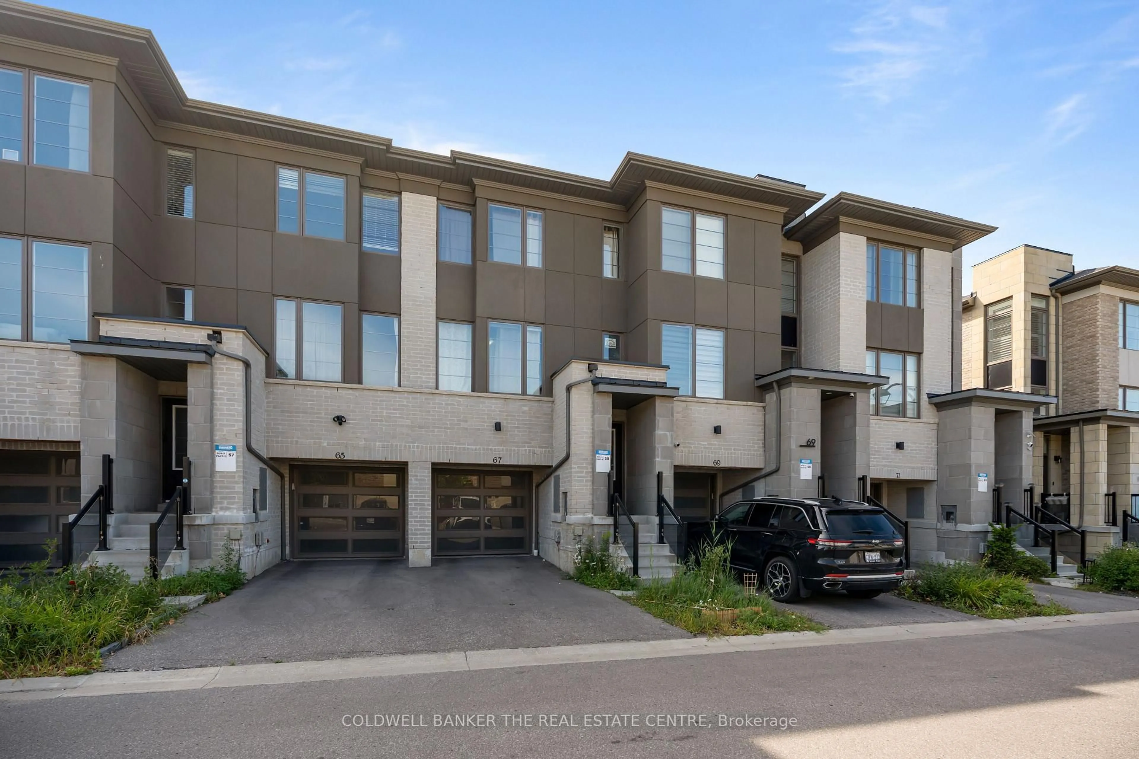 A pic from outside/outdoor area/front of a property/back of a property/a pic from drone, street for 67 Donald Fleming Way #106, Whitby Ontario L1R 0N8