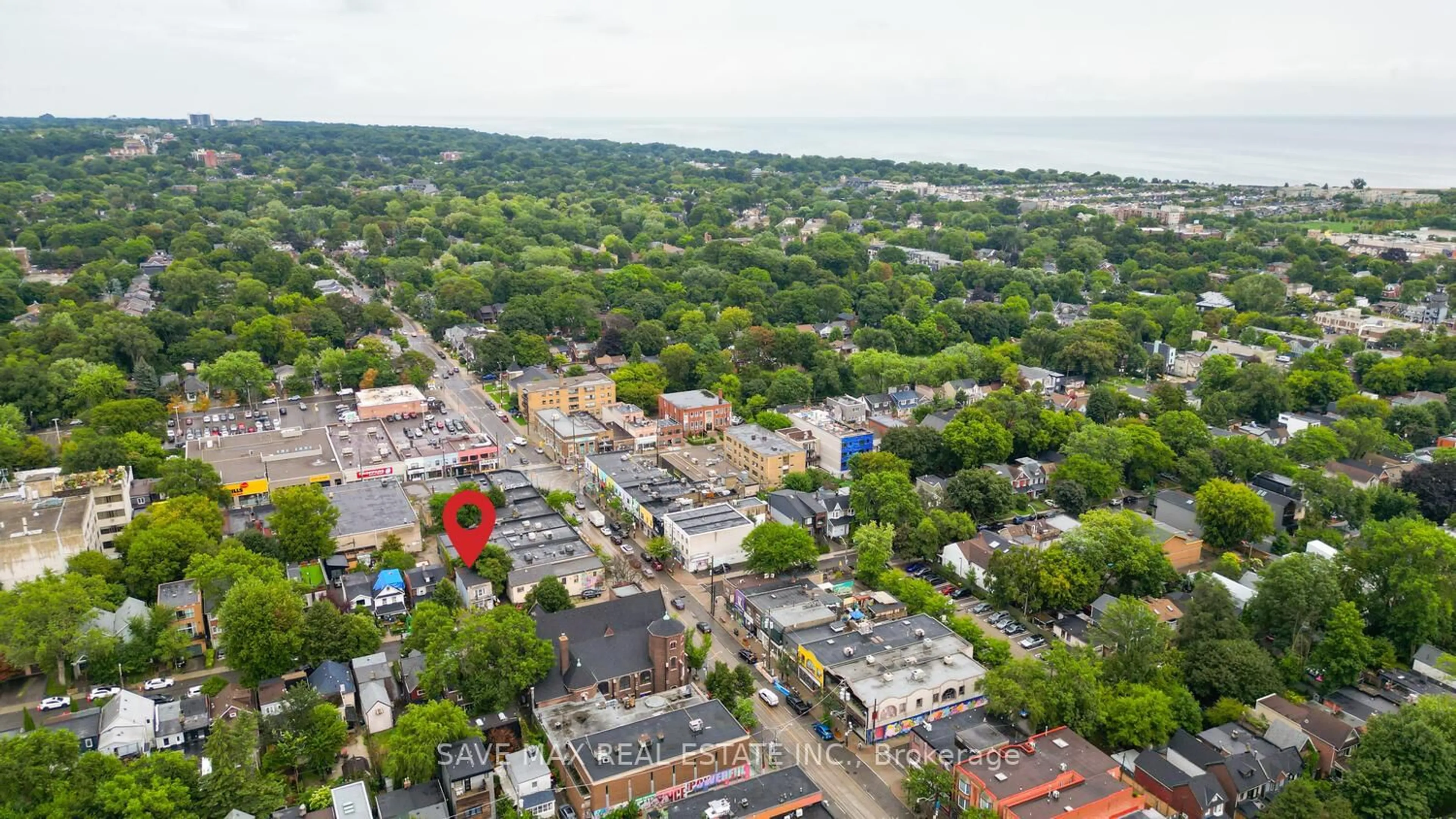 A pic from outside/outdoor area/front of a property/back of a property/a pic from drone, street for 283 Rhodes Ave, Toronto Ontario M4L 3A4