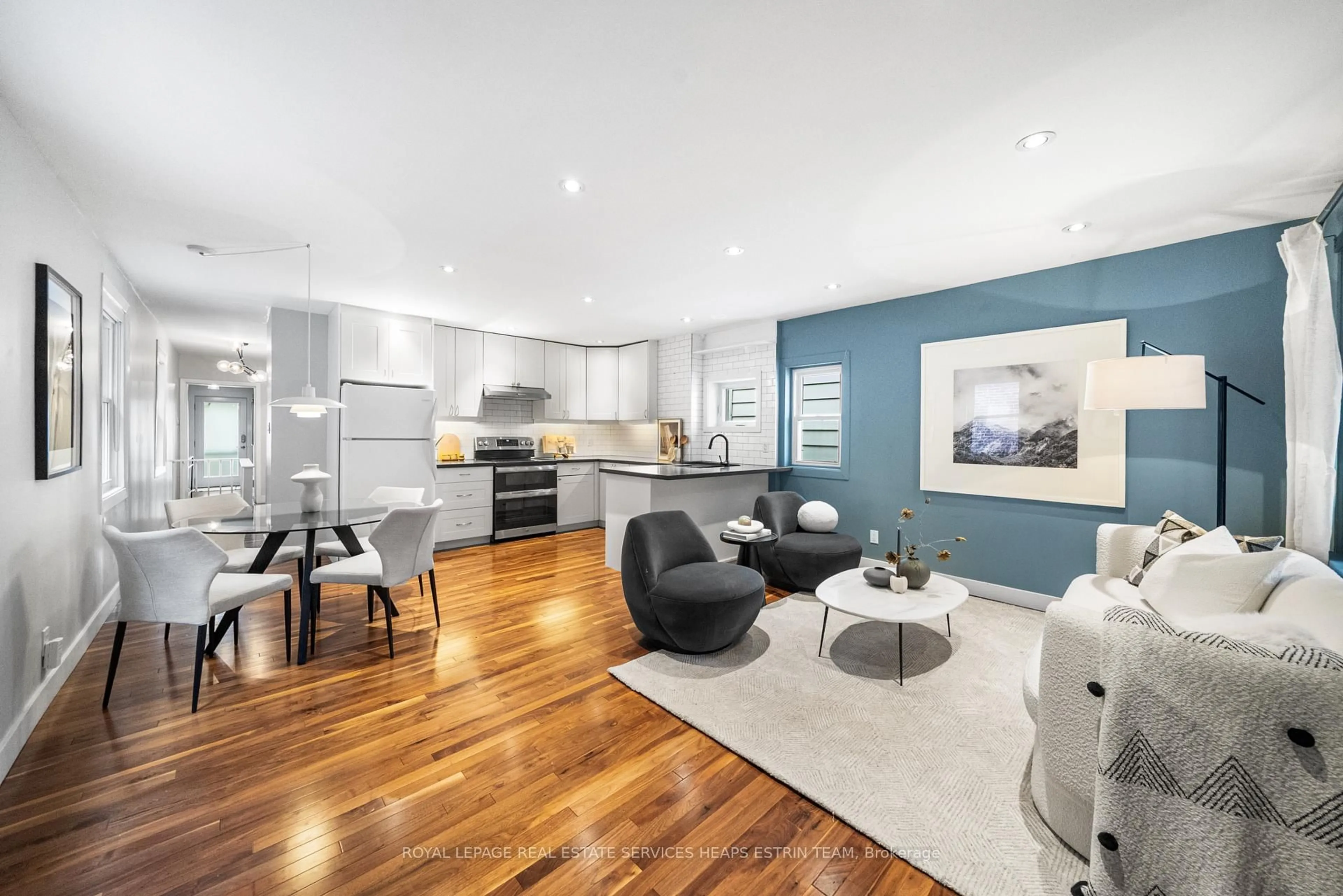 Open concept kitchen, wood/laminate floor for 130 Gamble Ave, Toronto Ontario M4J 2P3