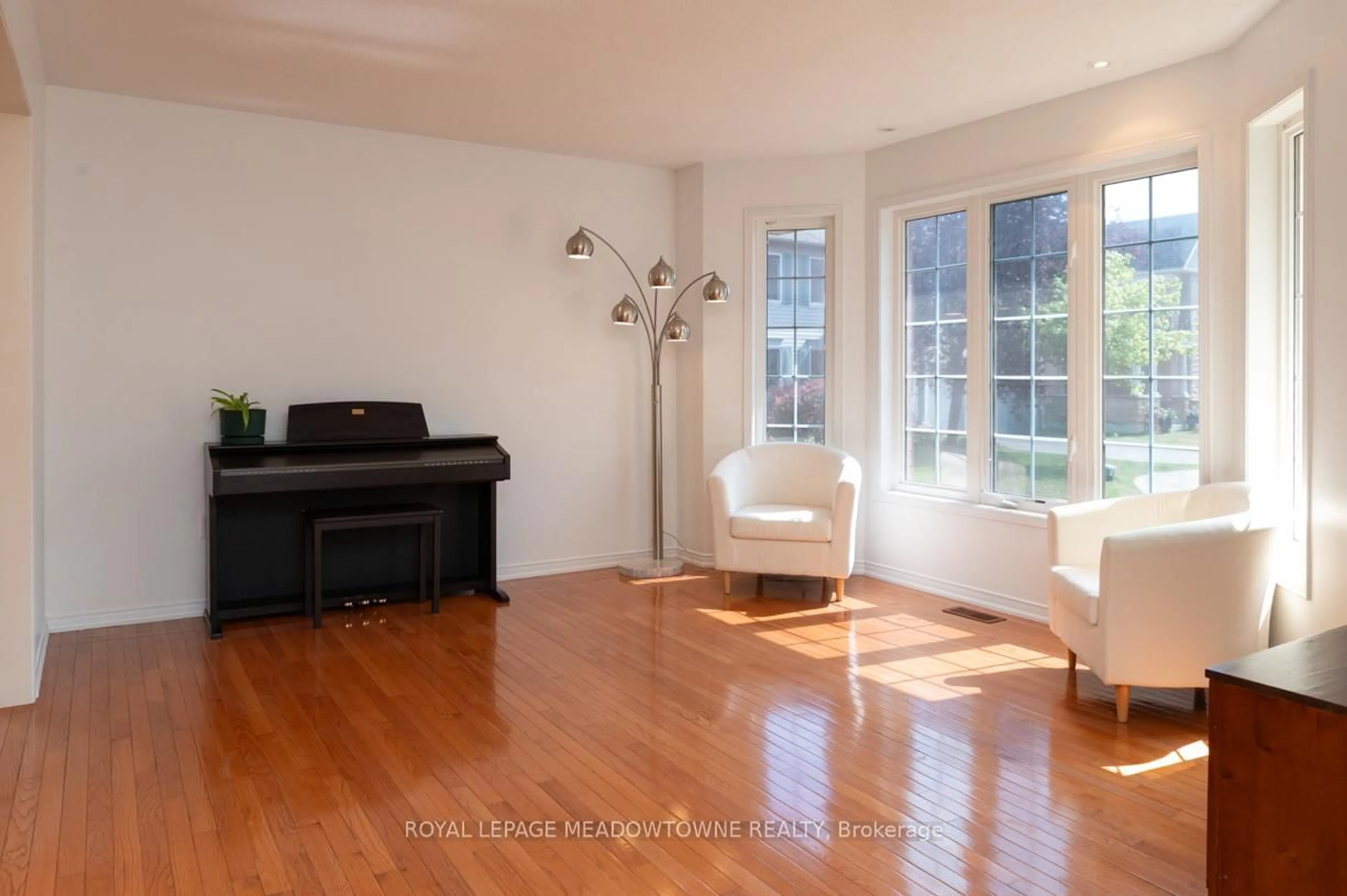 Living room with furniture, wood/laminate floor for 49 Montebello Cres, Ajax Ontario L1T 4P2