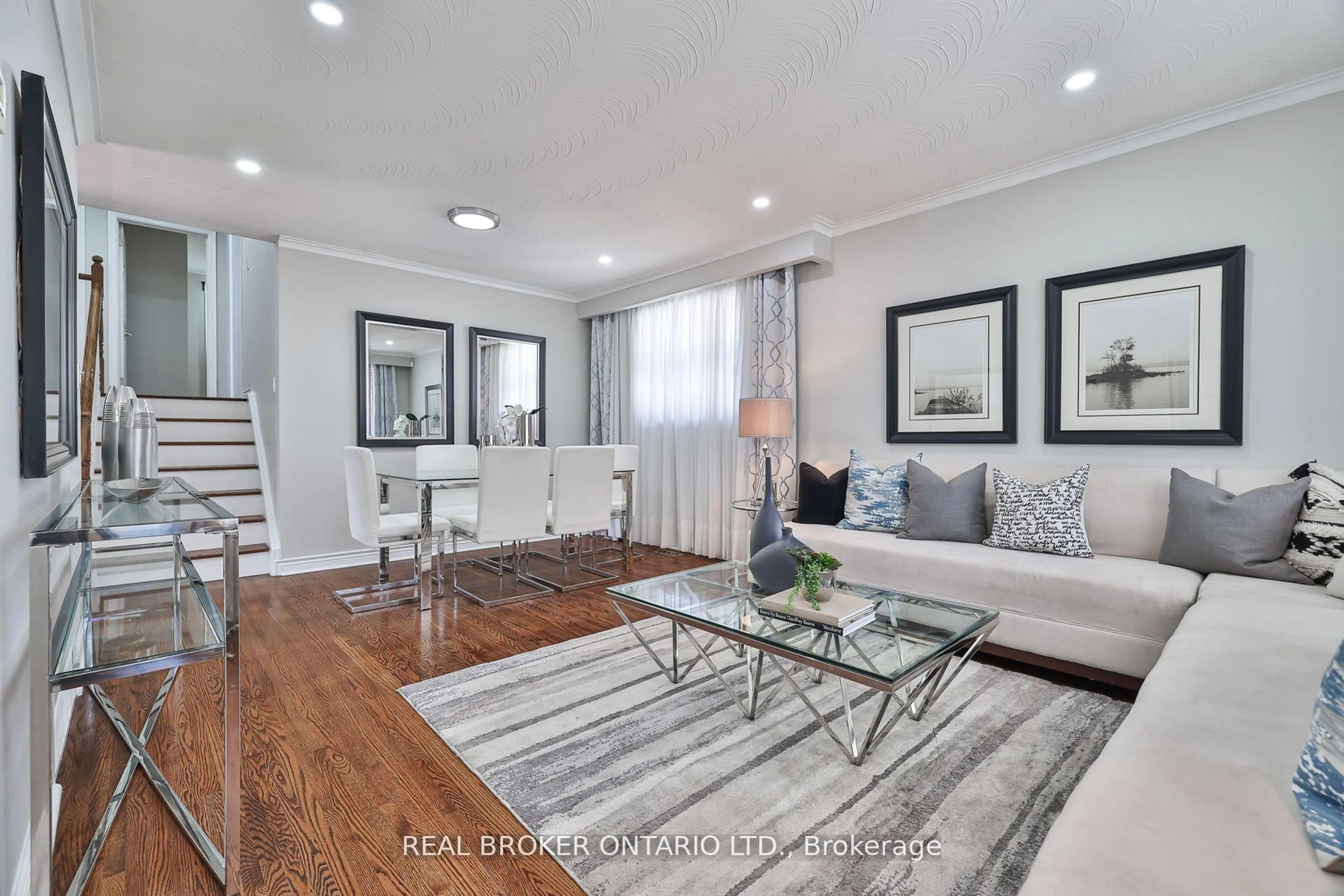 Living room with furniture, wood/laminate floor for 34 Alpaca Dr, Toronto Ontario M1J 2Z7