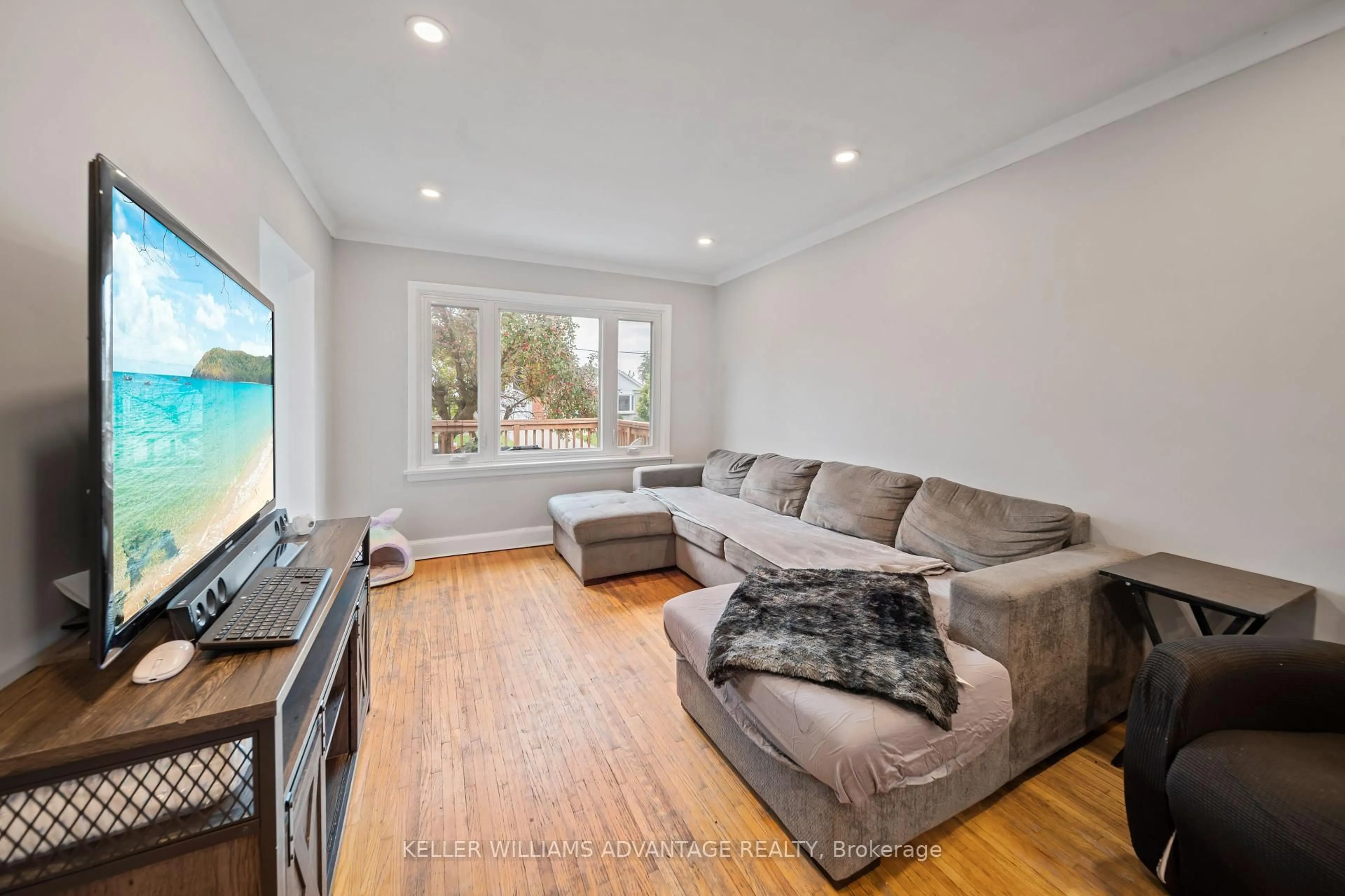 Living room with furniture, wood/laminate floor for 151 North Bonnington Ave, Toronto Ontario M1K 1Y2