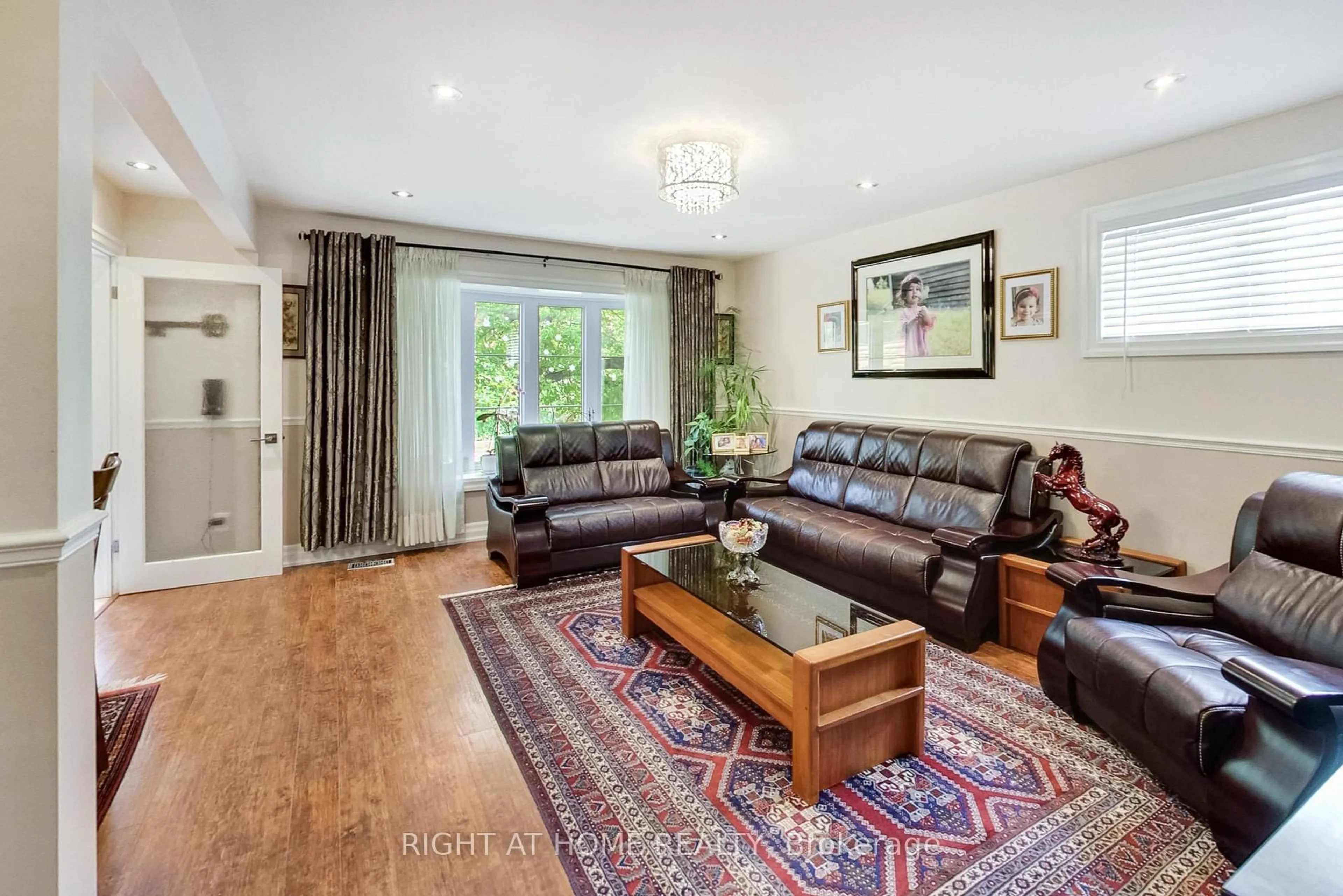 Living room with furniture, wood/laminate floor for 8 Suraty Ave, Toronto Ontario M1P 4E1