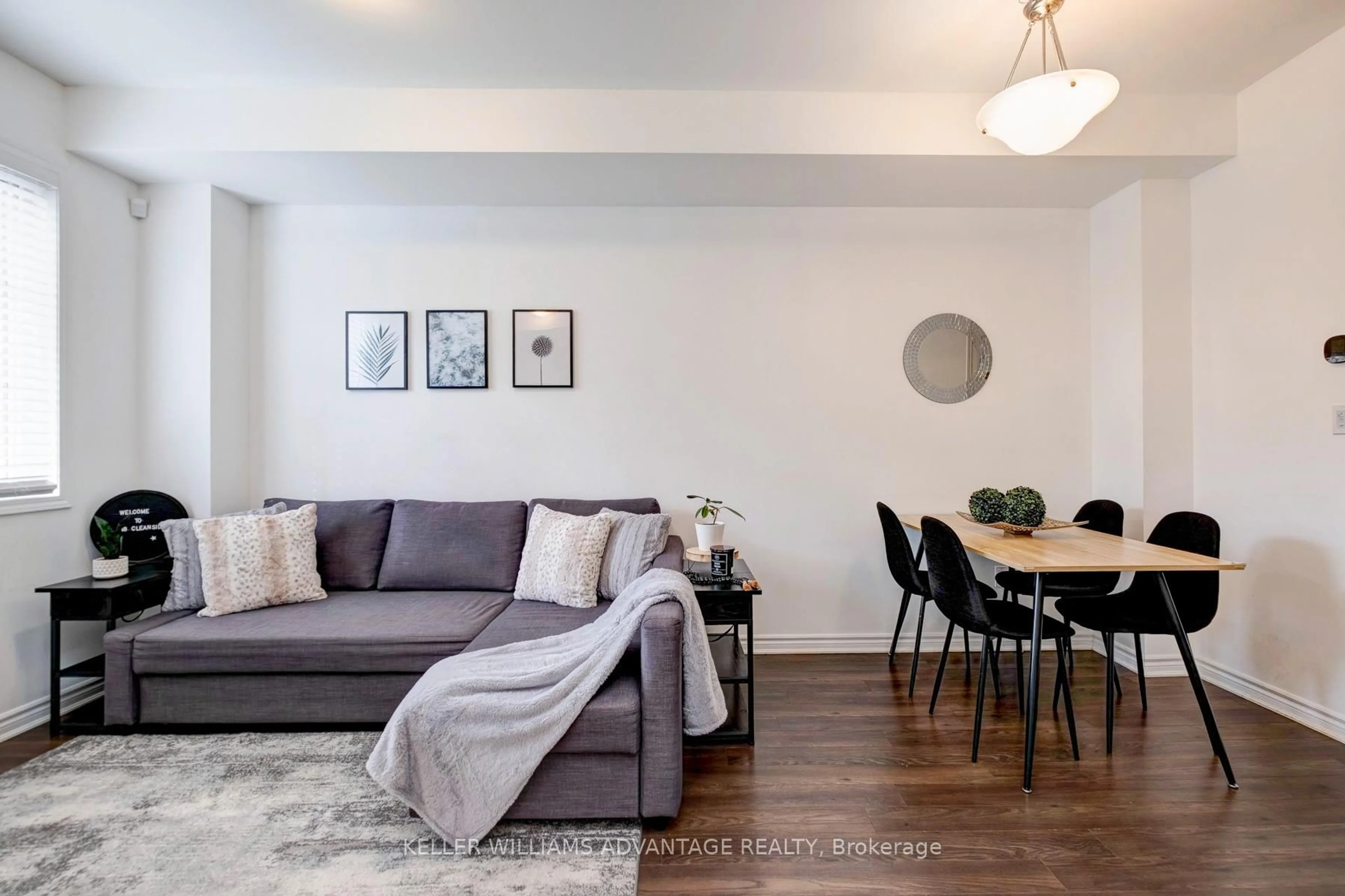 Living room with furniture, wood/laminate floor for 148 Cleanside Rd, Toronto Ontario M1L 0J3