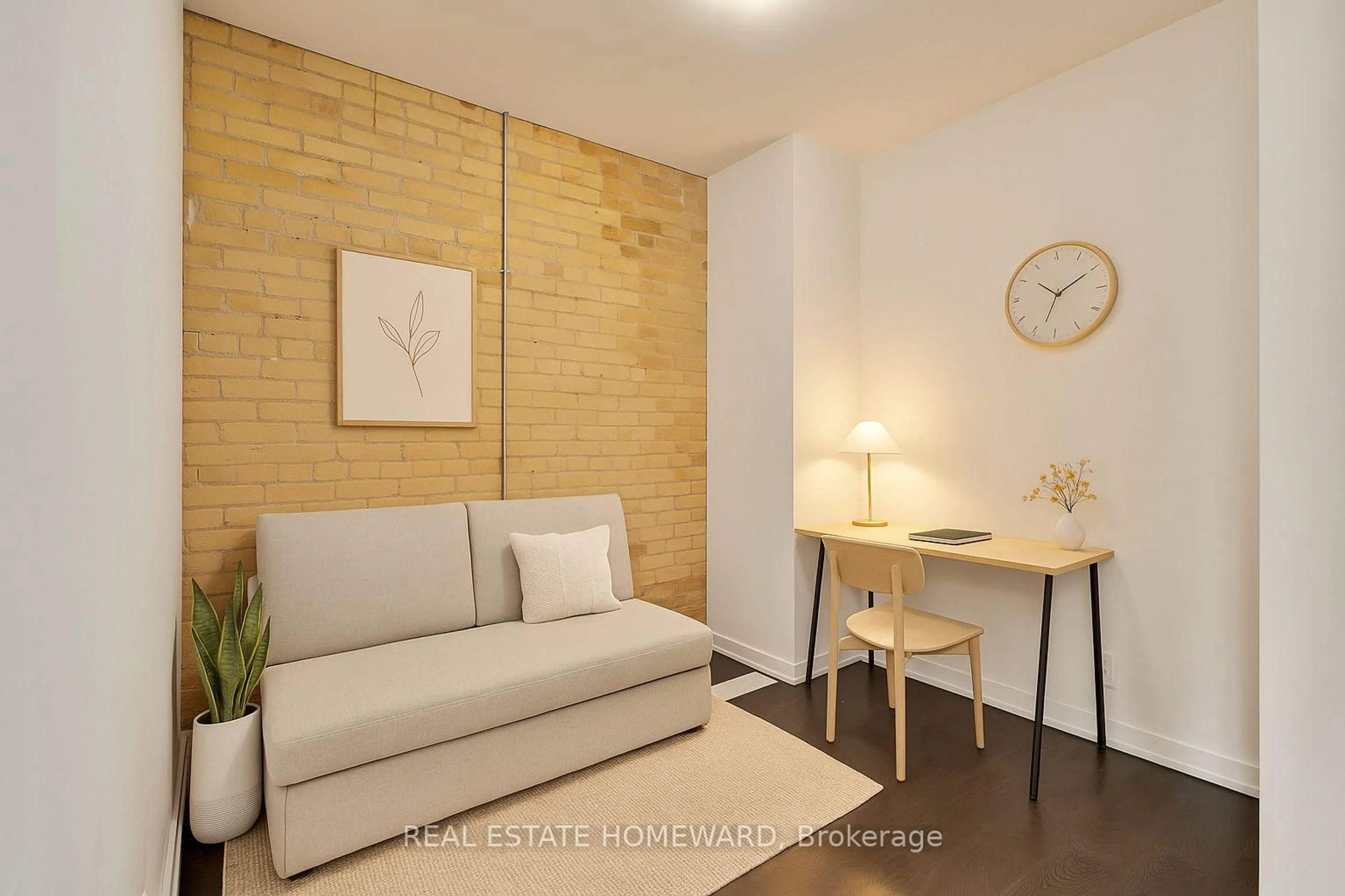 Living room with furniture, wood/laminate floor for 201 Carlaw Ave #128, Toronto Ontario M4M 2S3