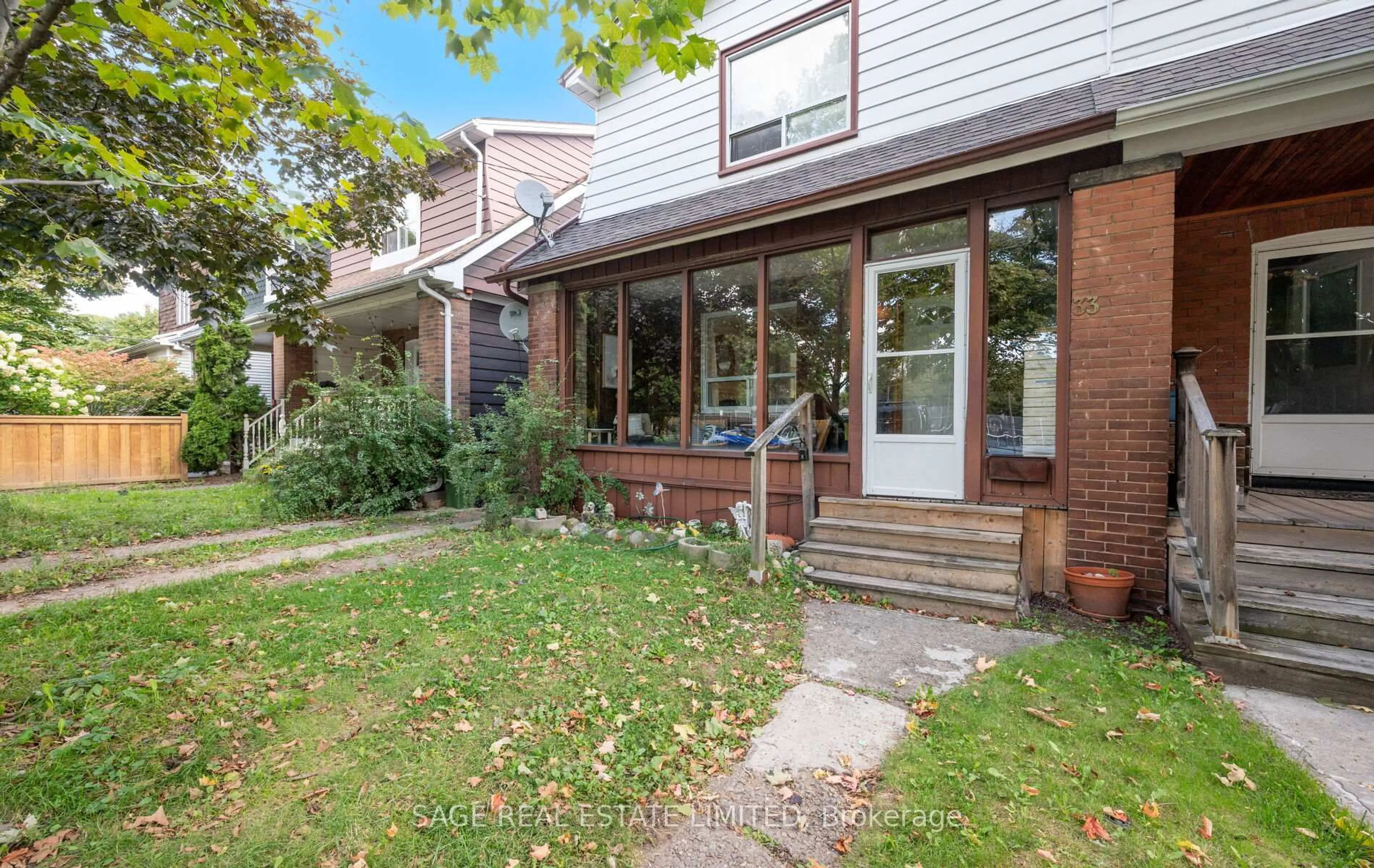Home with brick exterior material, street for 33 Avonlea Blvd, Toronto Ontario M4C 5E4