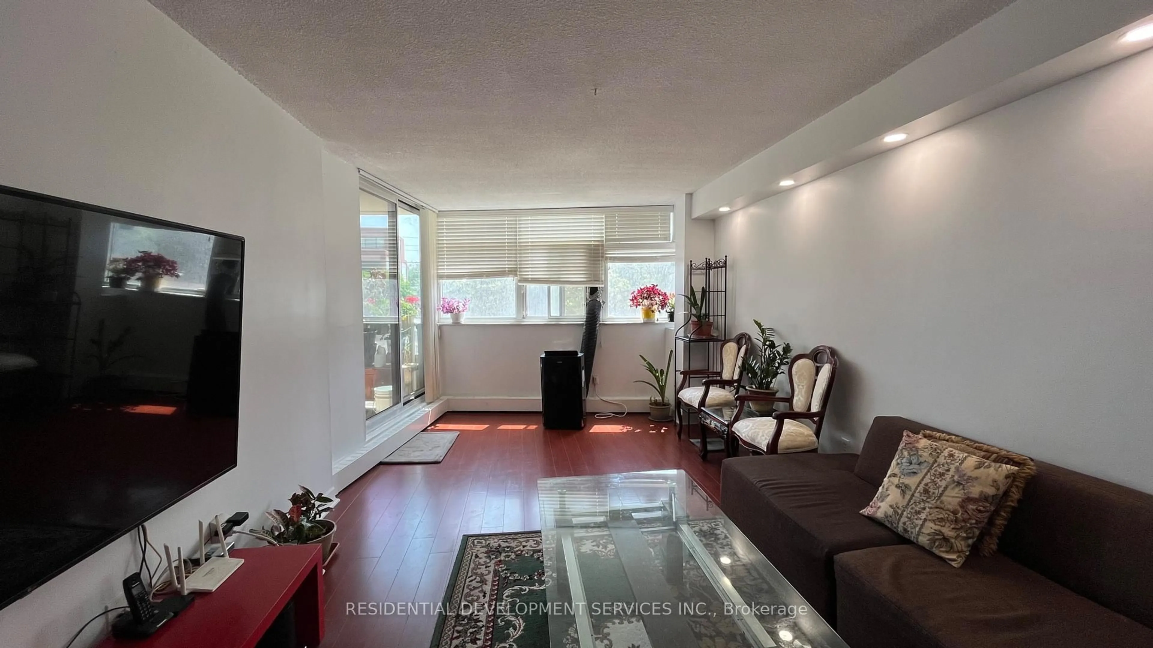 Living room with furniture, unknown for 2050 Bridletowne Circ #201, Toronto Ontario M1W 2V5