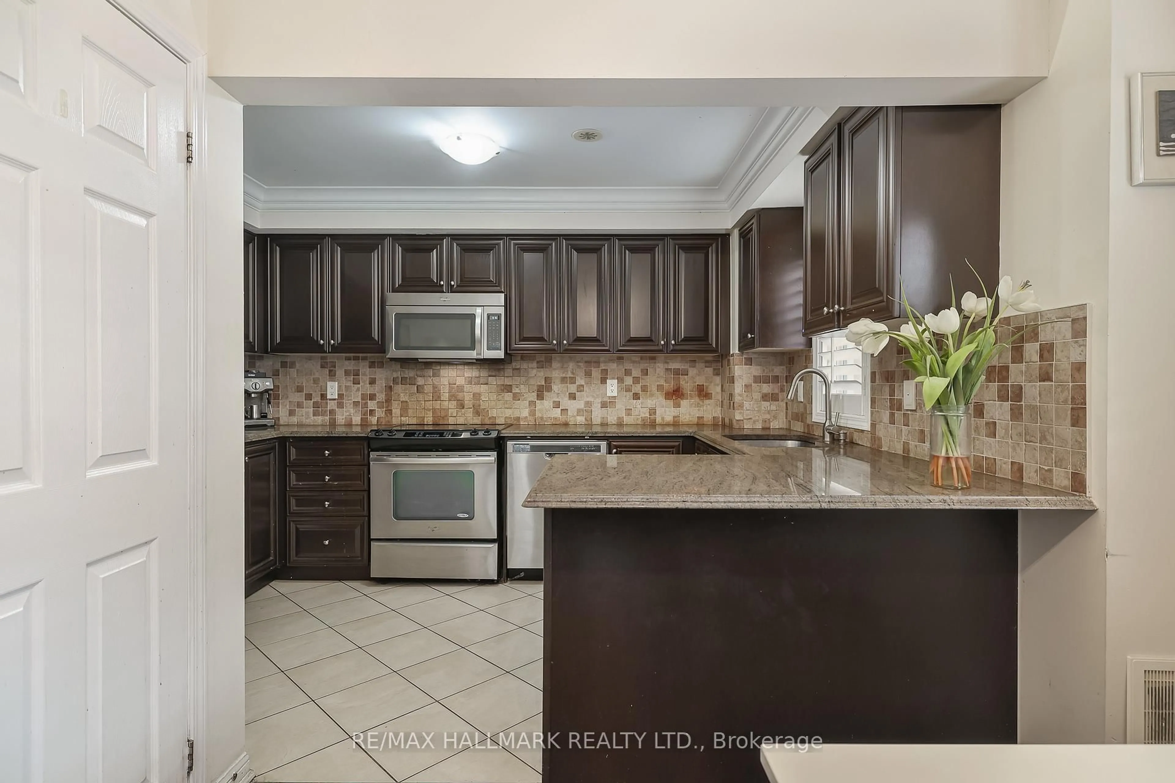 Open concept kitchen, ceramic/tile floor for 30 Mendelssohn St #9, Toronto Ontario M1L 0G8