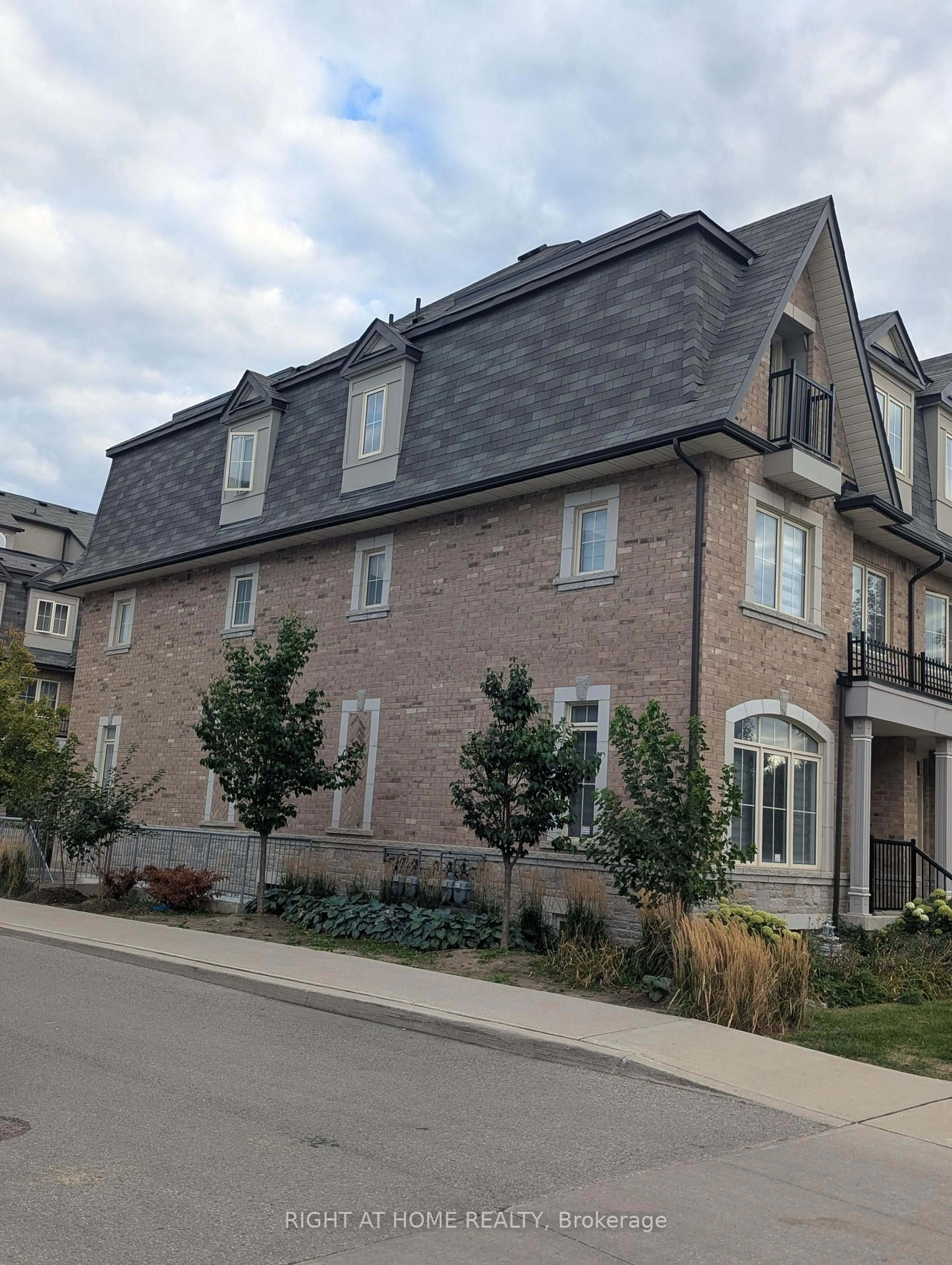 Home with brick exterior material, street for 1255 Bridletowne Circ #14, Toronto Ontario M1W 0A5