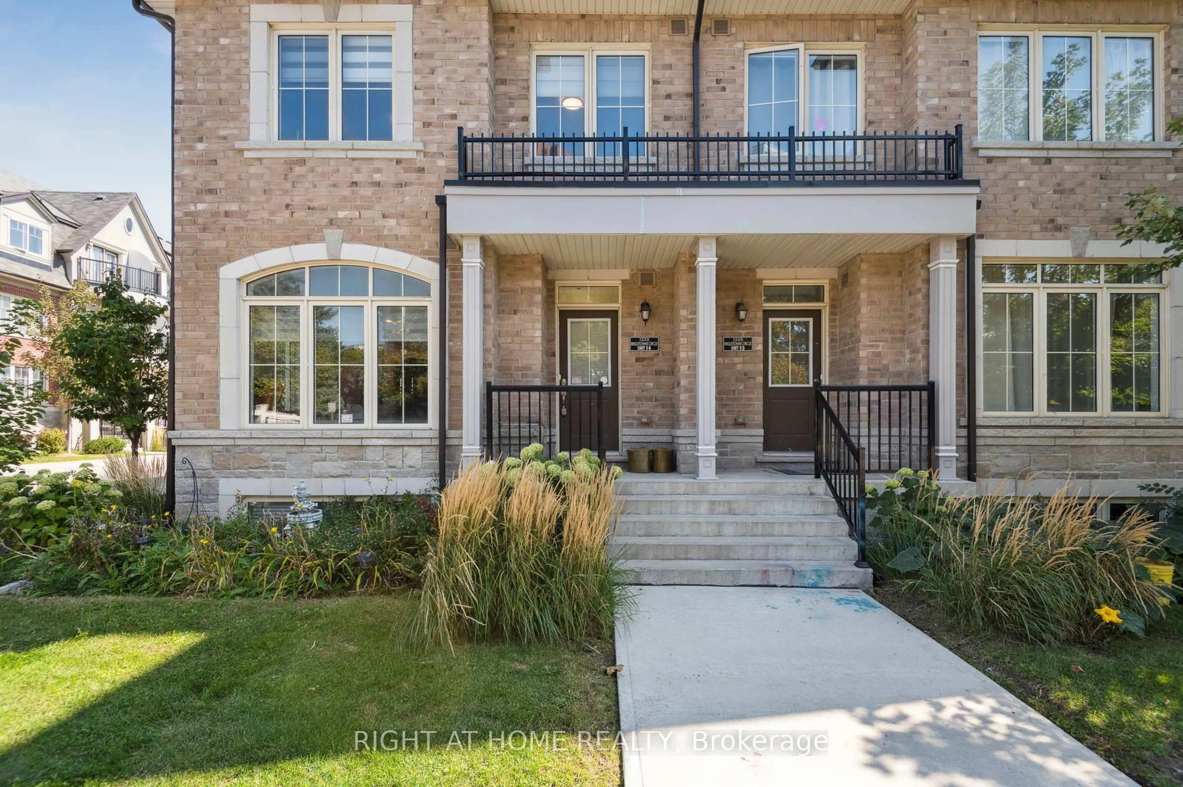 Home with brick exterior material, street for 1255 Bridletowne Circ #14, Toronto Ontario M1W 0A5