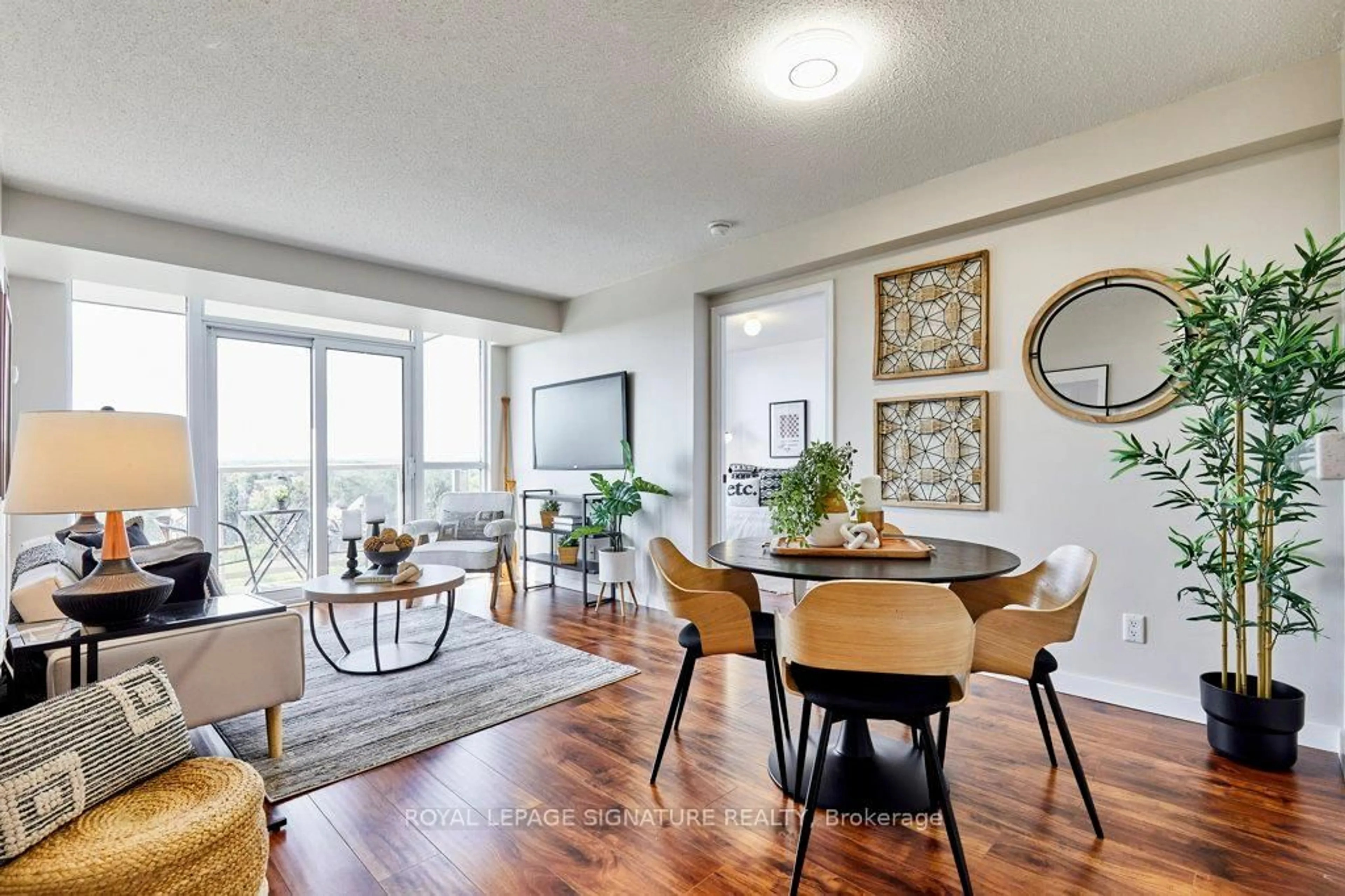 Living room with furniture, wood/laminate floor for 1200 The Esplanade #904, Pickering Ontario L1V 6V3