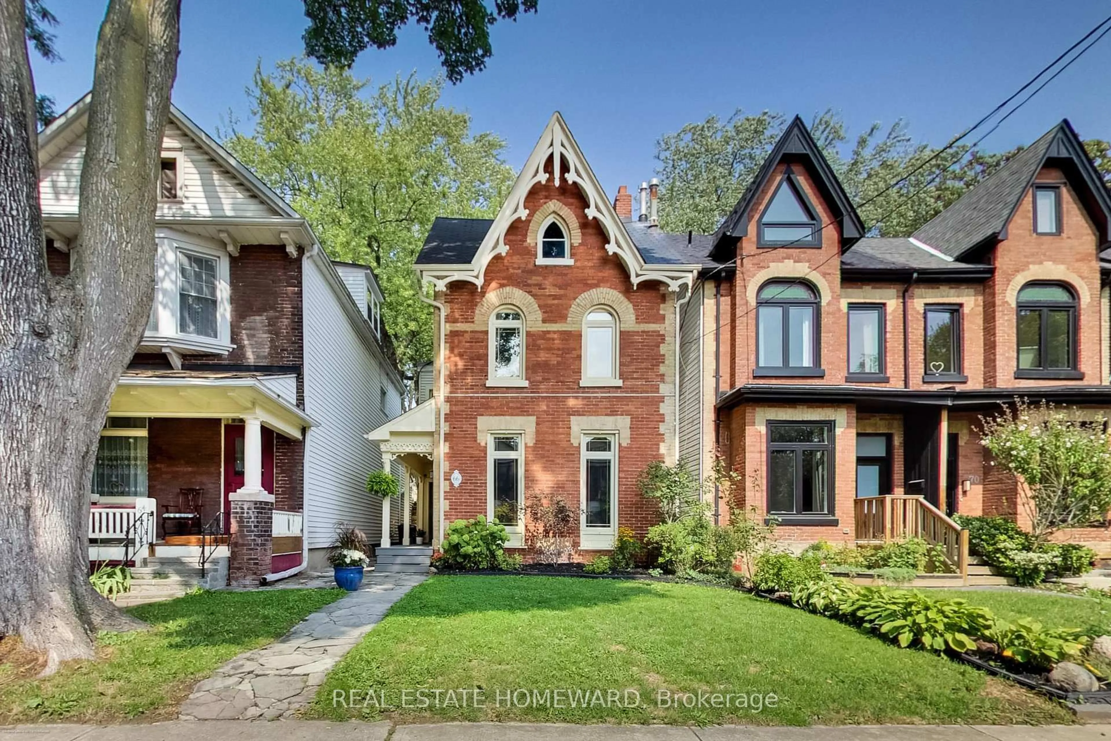 Home with brick exterior material, street for 66 Badgerow Ave, Toronto Ontario M4M 1V4