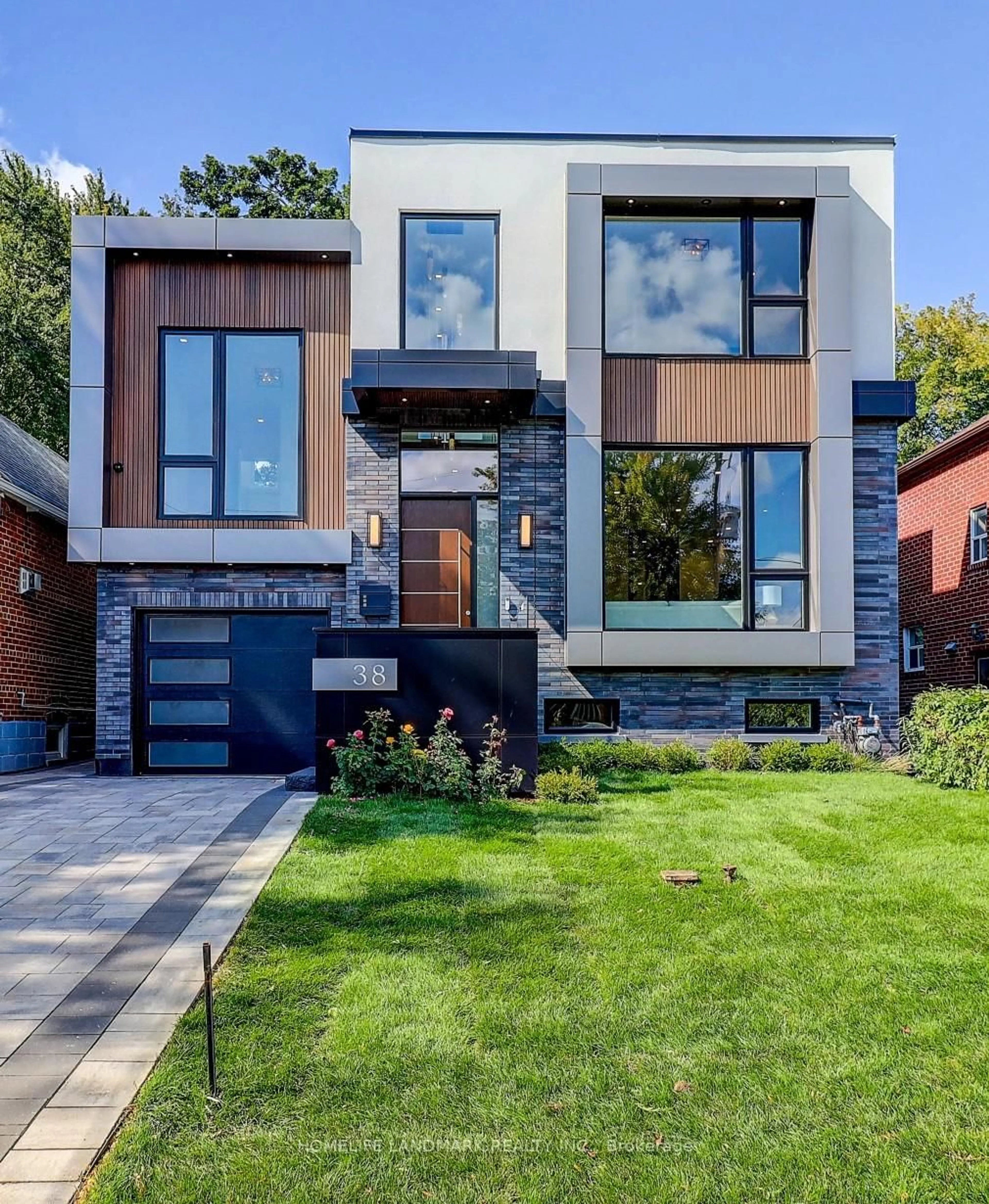 Home with brick exterior material, street for 38 Norlong Blvd, Toronto Ontario M4C 3W7