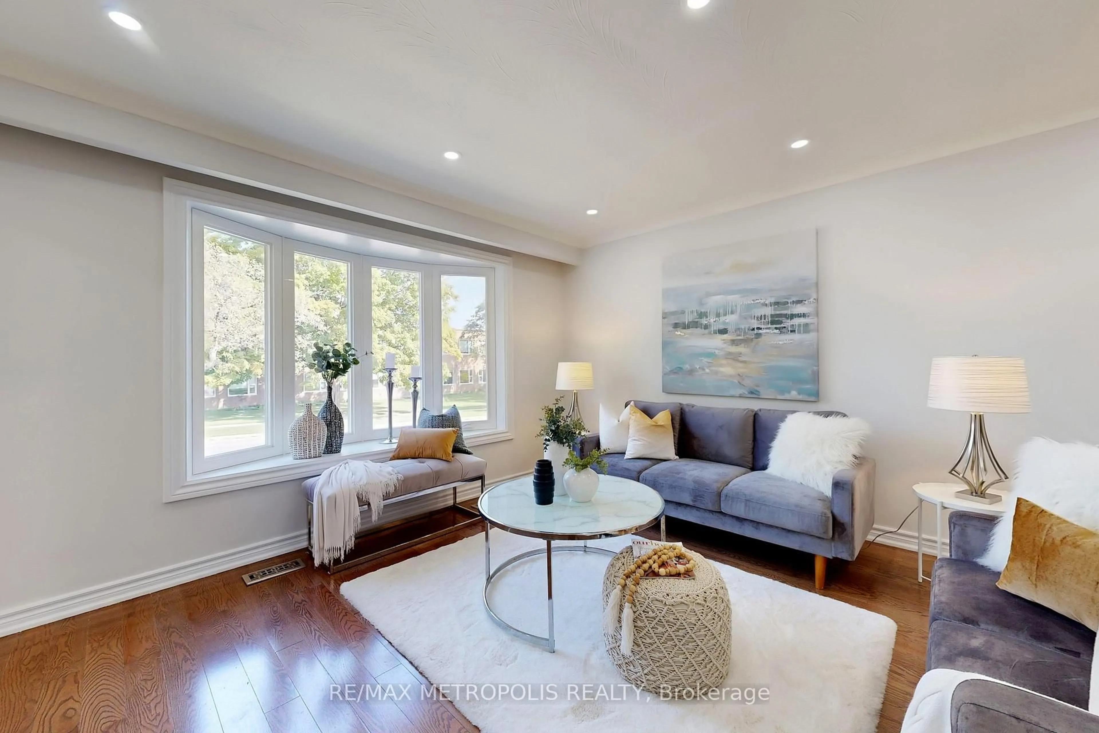 Living room with furniture, wood/laminate floor for 162 Lord Roberts Dr, Toronto Ontario M1K 3W9