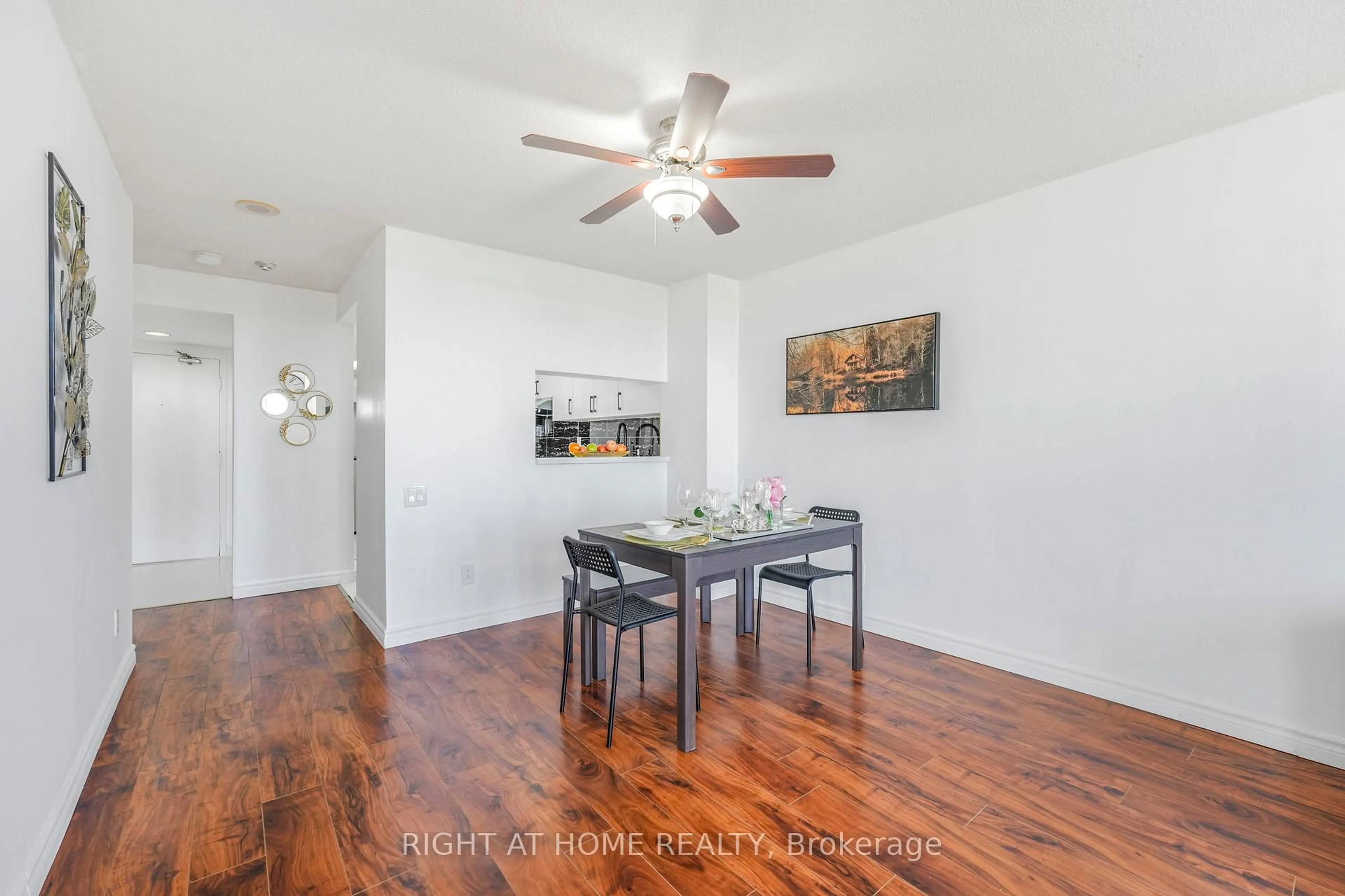 Dining room, wood/laminate floor for 2466 Eglinton Ave #707, Toronto Ontario M1K 5J8