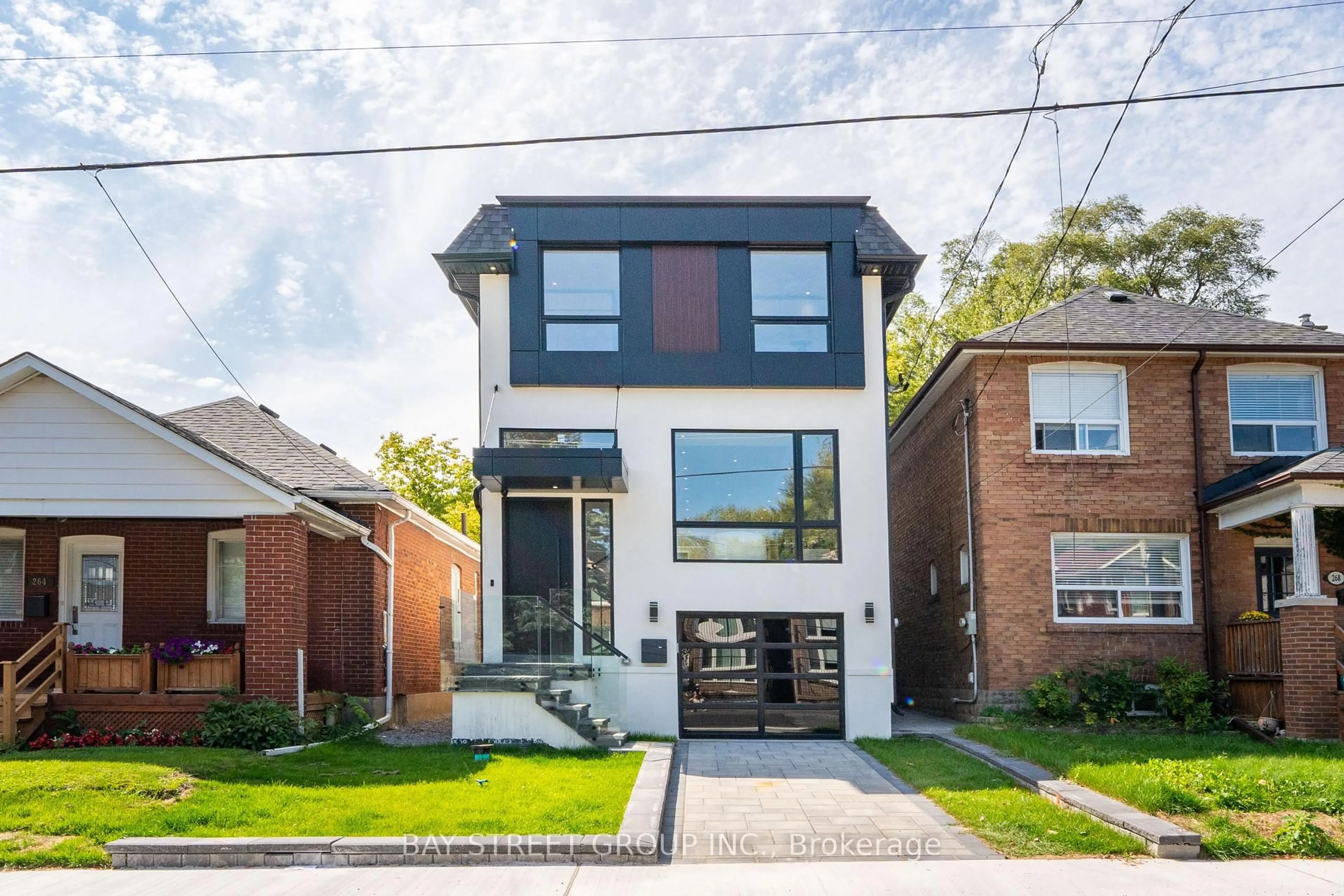 Home with brick exterior material, street for 266 Westlake Ave, Toronto Ontario M4C 4T6