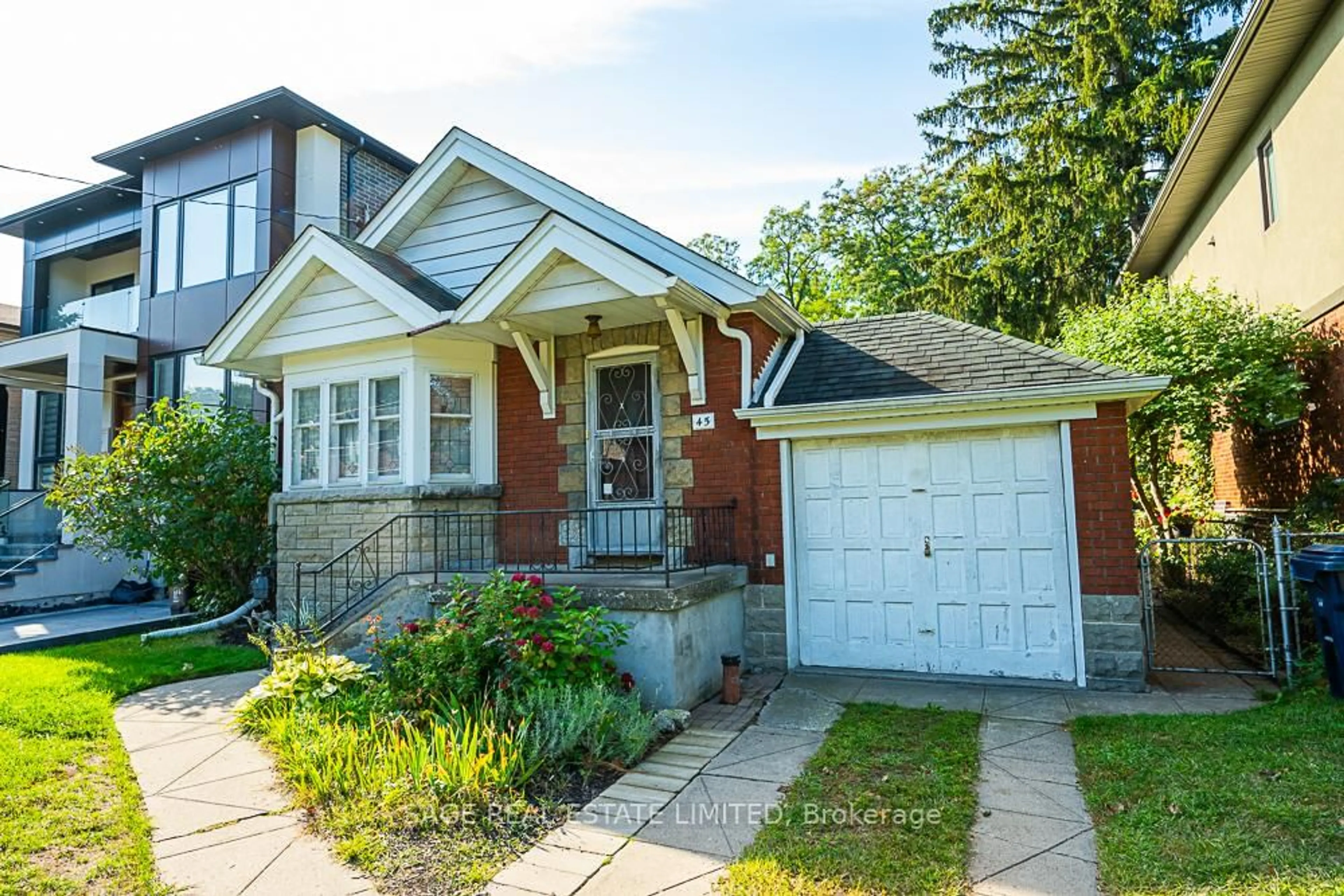 Home with brick exterior material, street for 45 Four Oaks Gate, Toronto Ontario M4J 2X3
