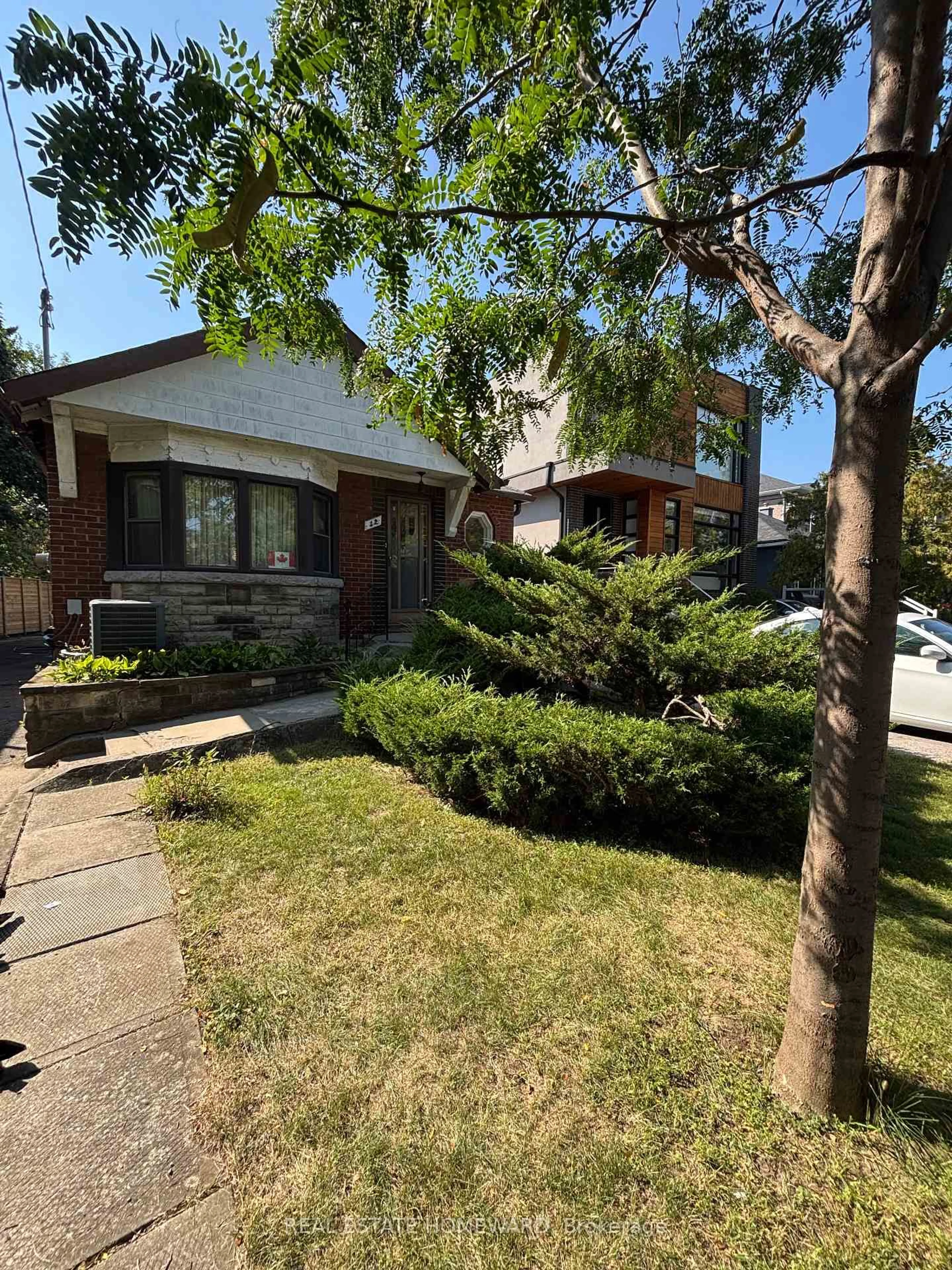 Home with brick exterior material, street for 12 St Hubert Ave, Toronto Ontario M4J 3Y9