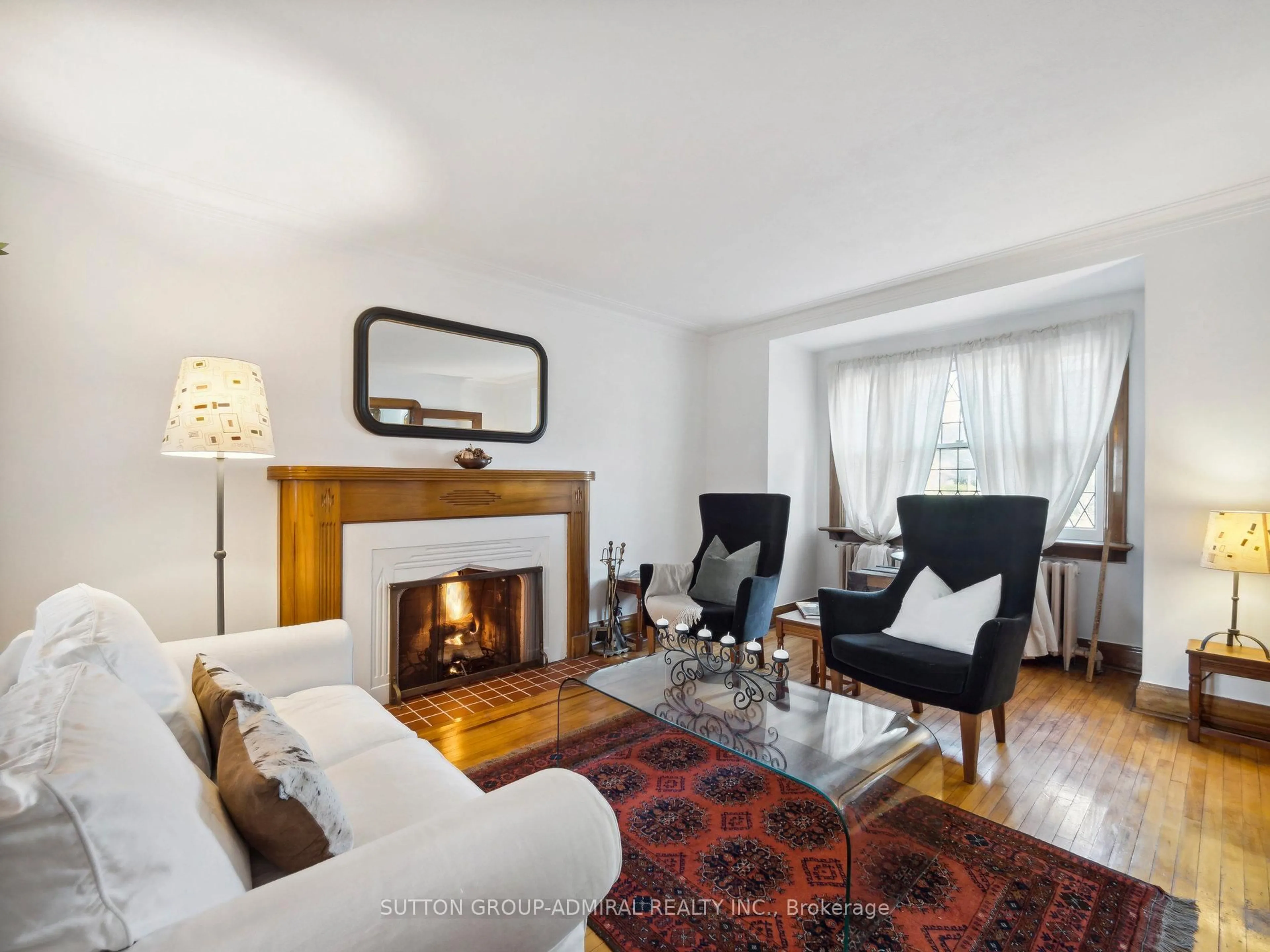 Living room with furniture, wood/laminate floor for 4 Don Mills Rd, Toronto Ontario M4J 3Z7